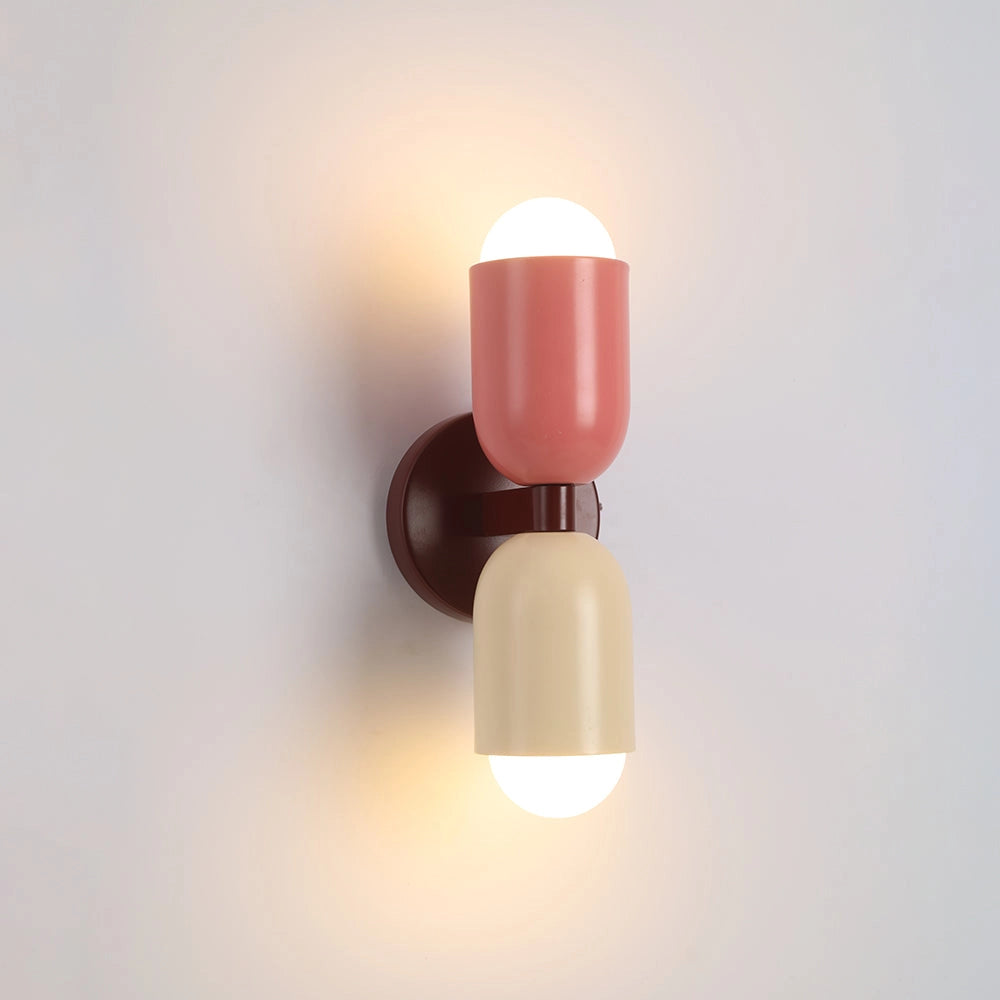 Modern olive green LED wall sconce with a minimalist design featuring dual bulbs, mounted on a wooden base.
