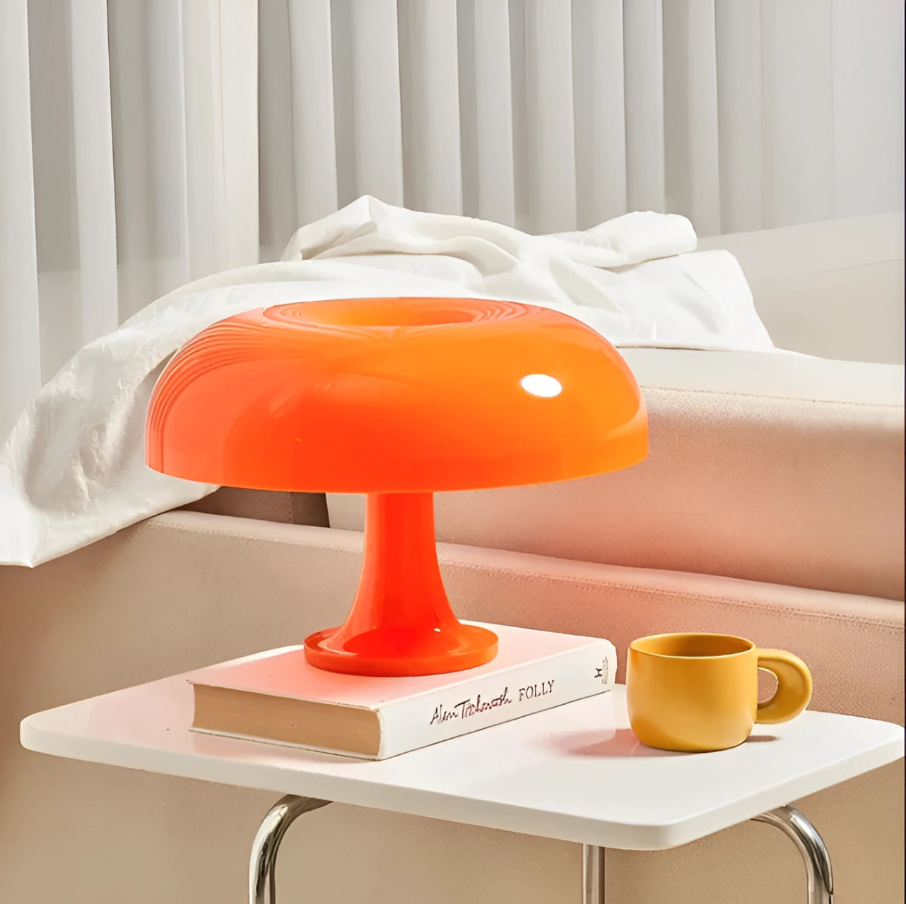 Orange mushroom lamp with a retro 70s style, featuring a mid-century design. The lamp is placed on a table, contributing to the interior design with its vibrant orange hue.