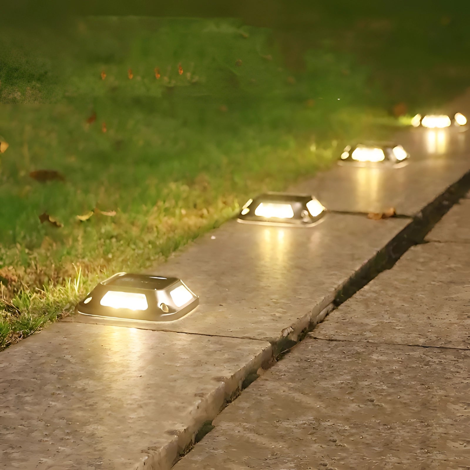 Outdoor LED solar path lights illuminating a pathway, showcasing their waterproof and eco-friendly design under sunlight on an asphalt road with plants visible nearby.