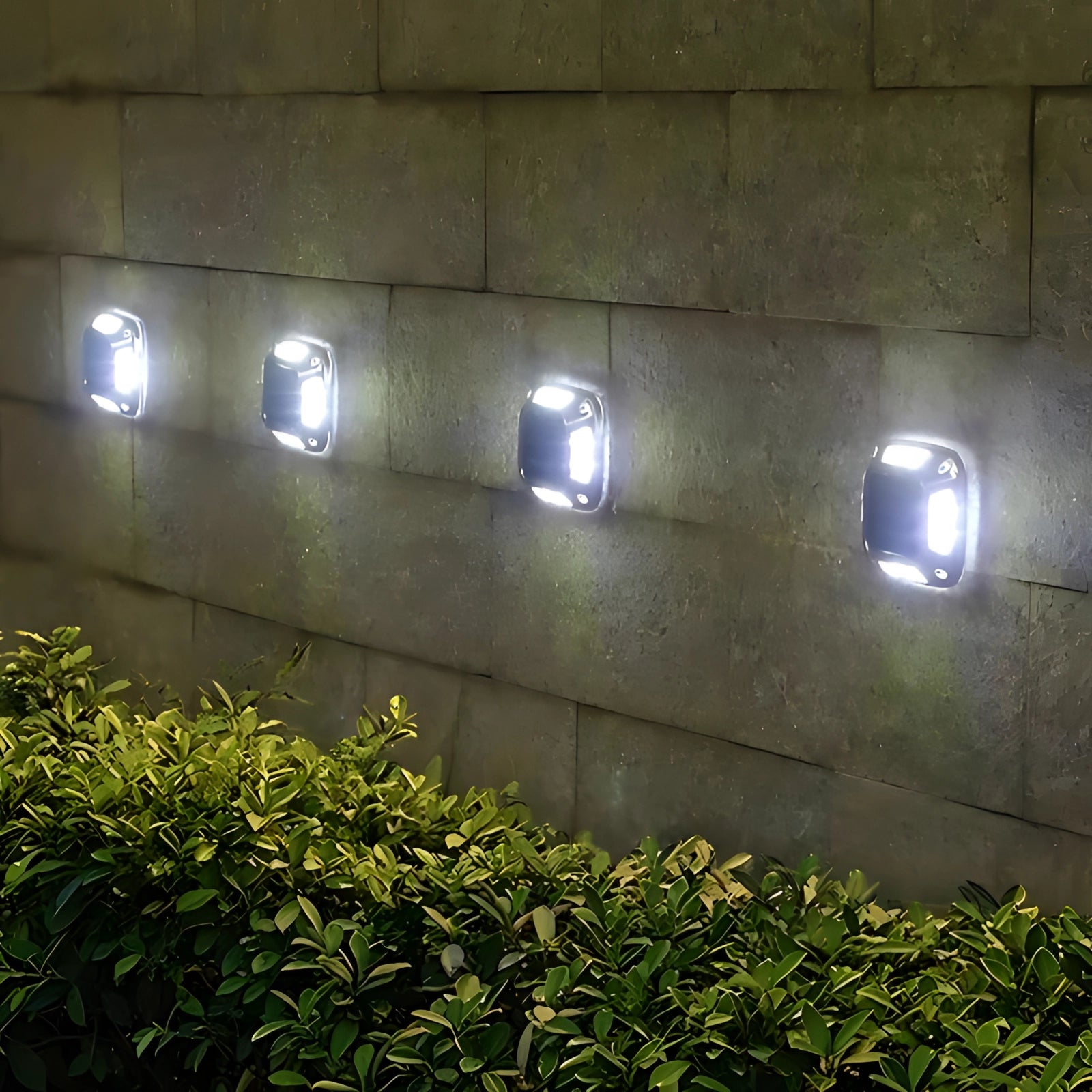 Outdoor solar path lights illuminating a grassy area at night, featuring a set of eight white LED lights designed for outdoor pathways. The lights are waterproof and eco-friendly, providing security lighting with a modern rectangular design.