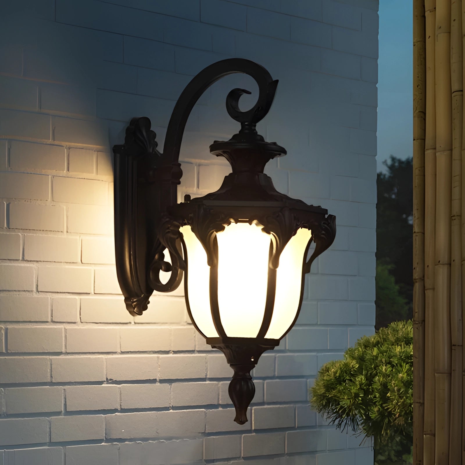 Outdoor wall lantern with a vintage bronze finish, featuring weather-resistant materials, designed for outdoor lighting.