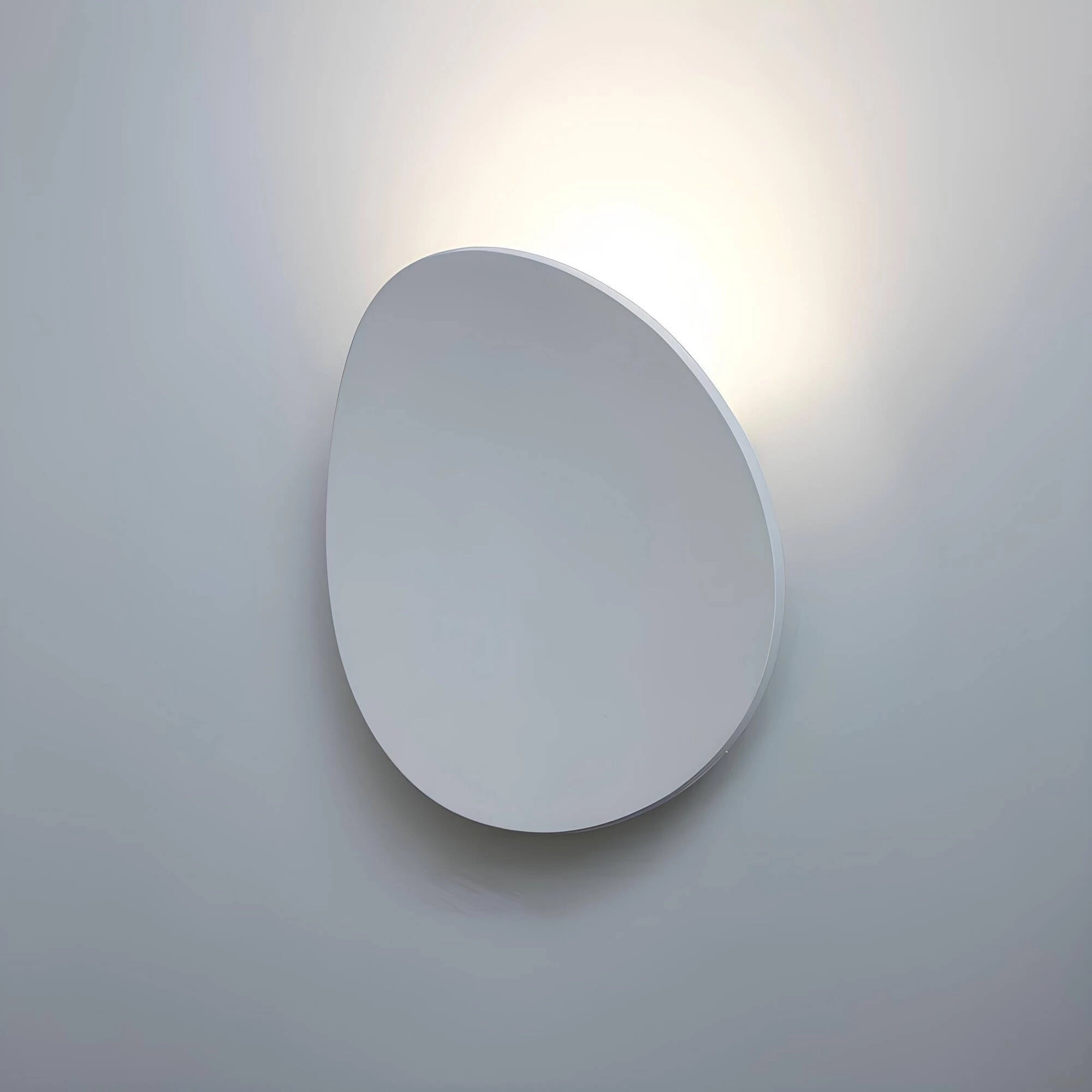 Oval wall mirror with a minimalist modern design, featuring a sleek white frame, ideal for enhancing contemporary home decor.