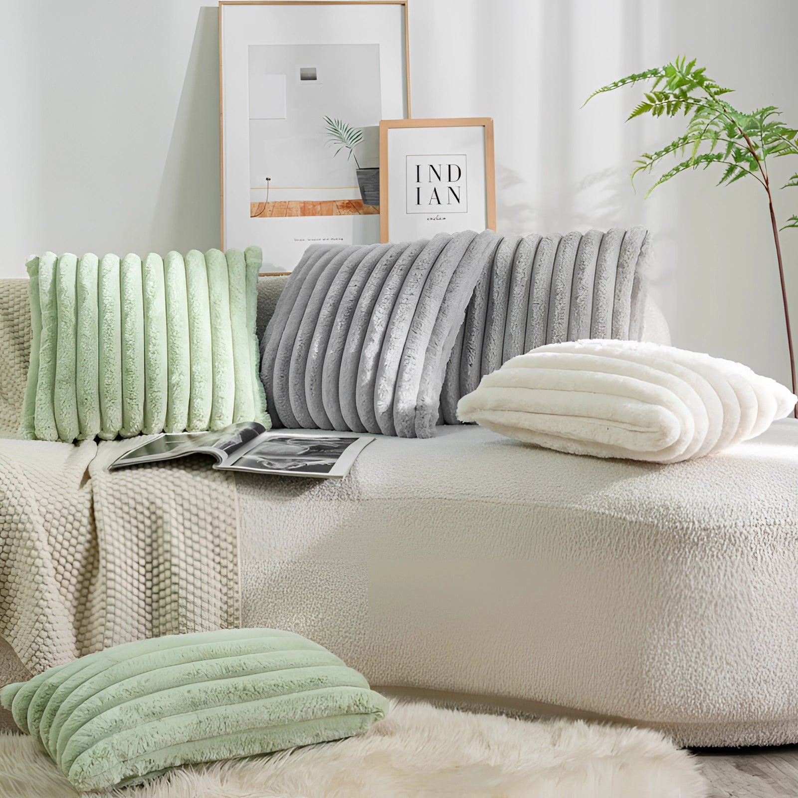 Pink corduroy pillow with soft ribbed texture placed on a wooden surface, surrounded by indoor plants, enhancing the cozy and pastel-themed interior design.