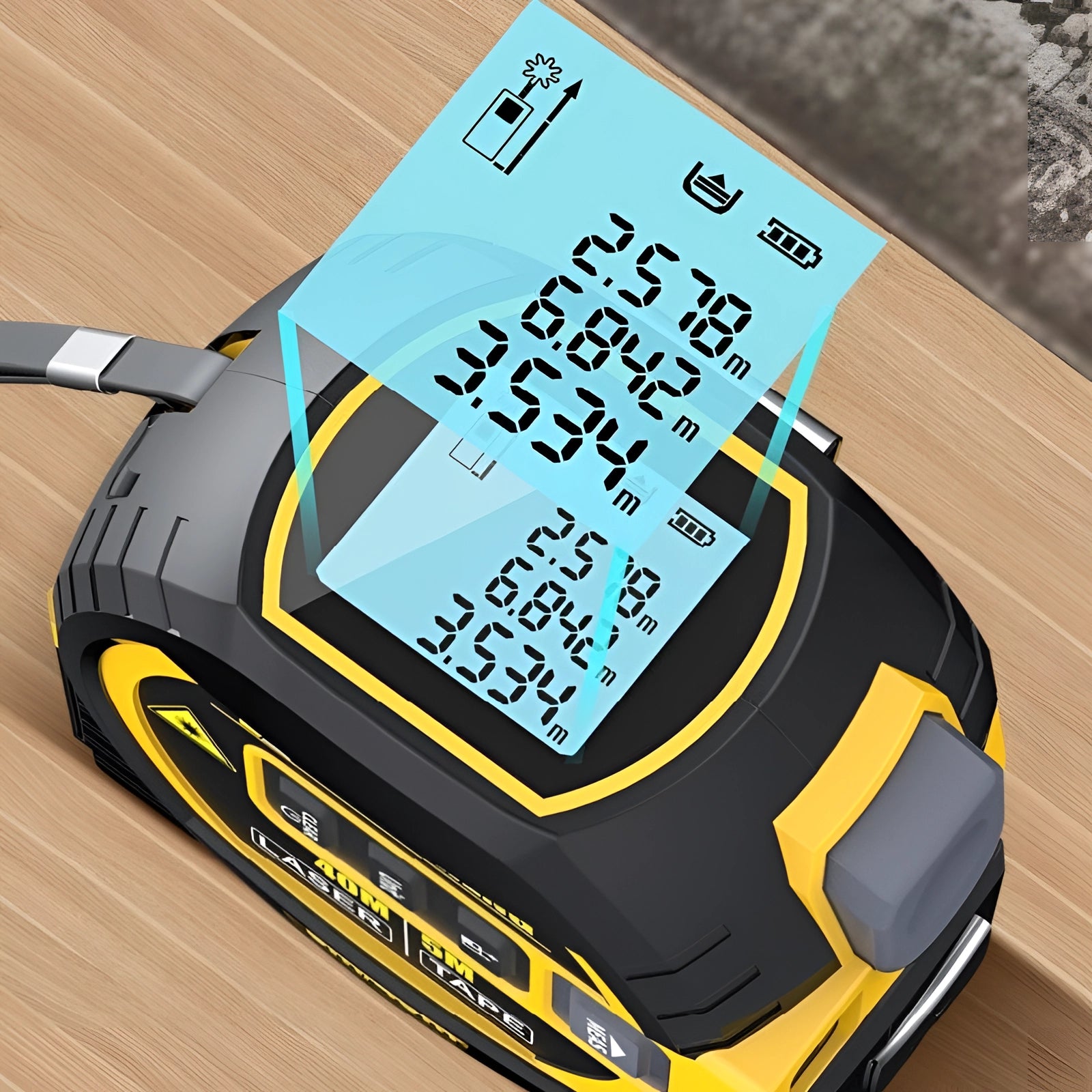 A portable USB laser distance meter placed on the hood of a car, showcasing its compact design and functionality for automotive applications.