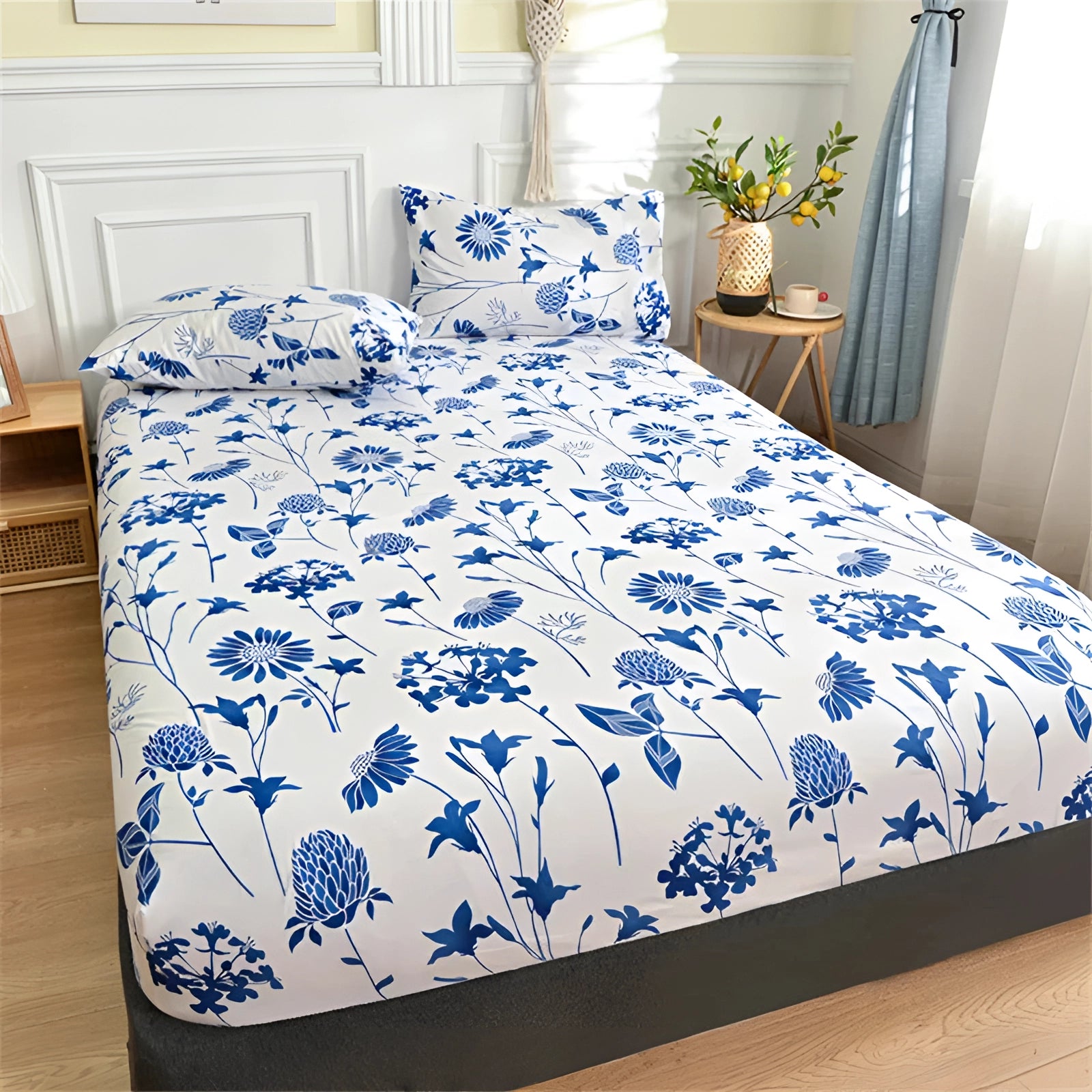 Blue floral duvet cover set featuring a modern botanical pattern, displayed on a queen-sized bed in a well-designed interior bedroom setting.