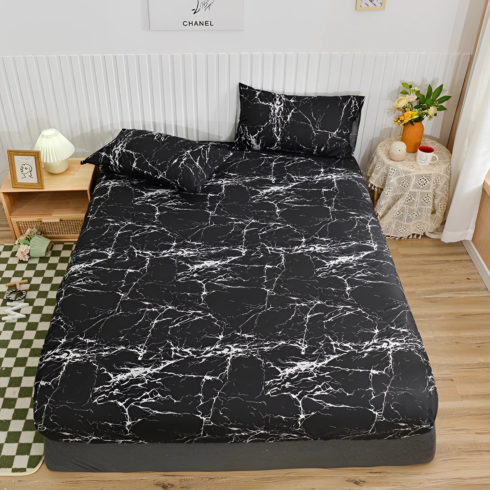 Queen size blue floral duvet cover set featuring a modern botanical pattern on a neatly made bed with grey pillows, placed in a stylish interior with visible hardwood elements and a wooden bed frame.