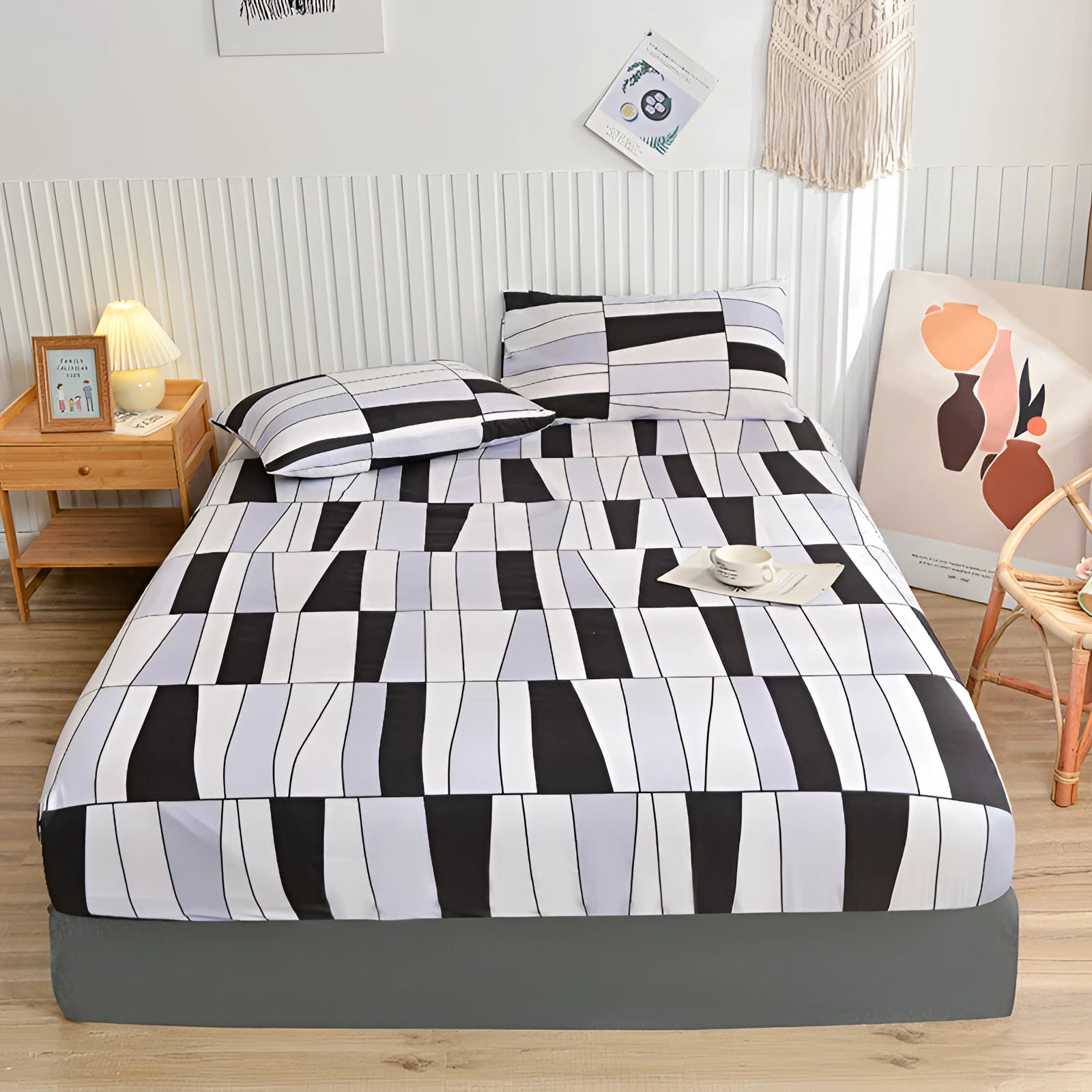Queen size blue floral duvet cover set with a modern botanical pattern, displayed on a bed with a grey bed frame in a well-designed bedroom interior.