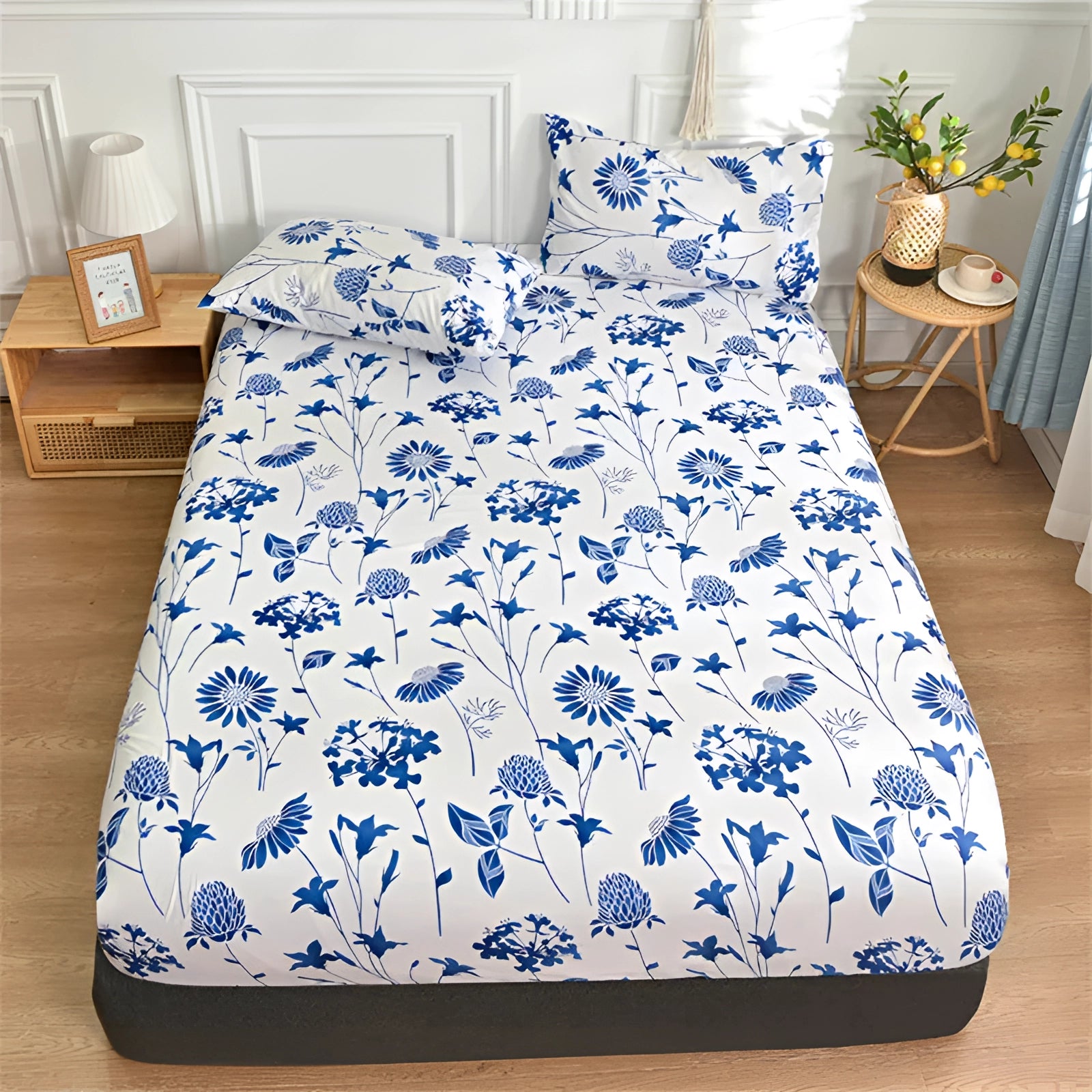 Queen size duvet cover set in blue with a modern botanical pattern, featuring a floral design against a white background. The set is displayed on a neatly made bed, complemented by matching pillows, and fits seamlessly within a stylishly designed interior.