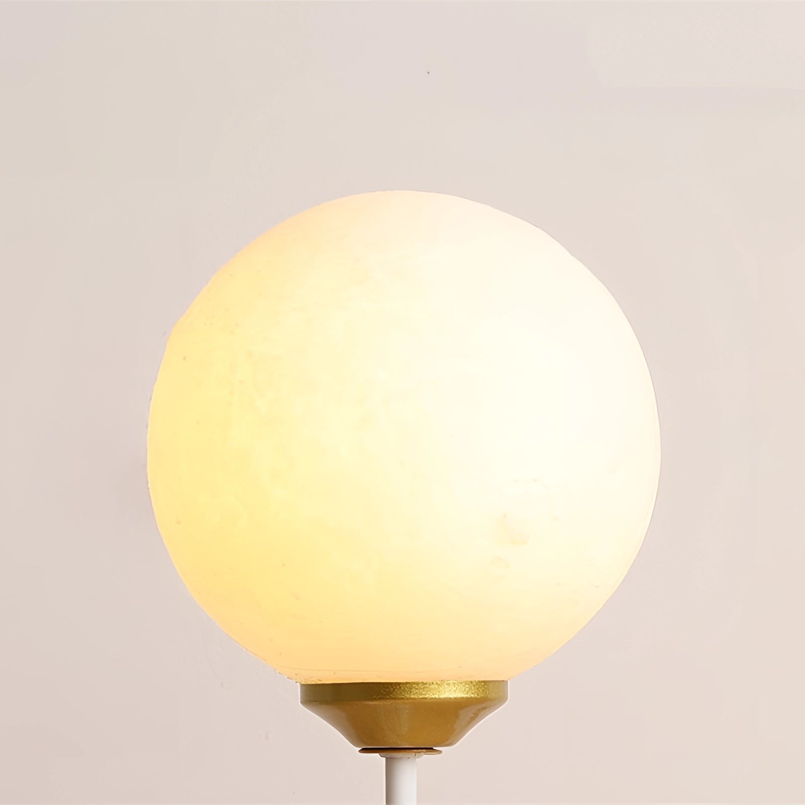 Rabbit-shaped balloon wall lamp designed for children's rooms, featuring a whimsical design with a beige tint and circular light fixture, made from wood to resemble a piece of playful art.