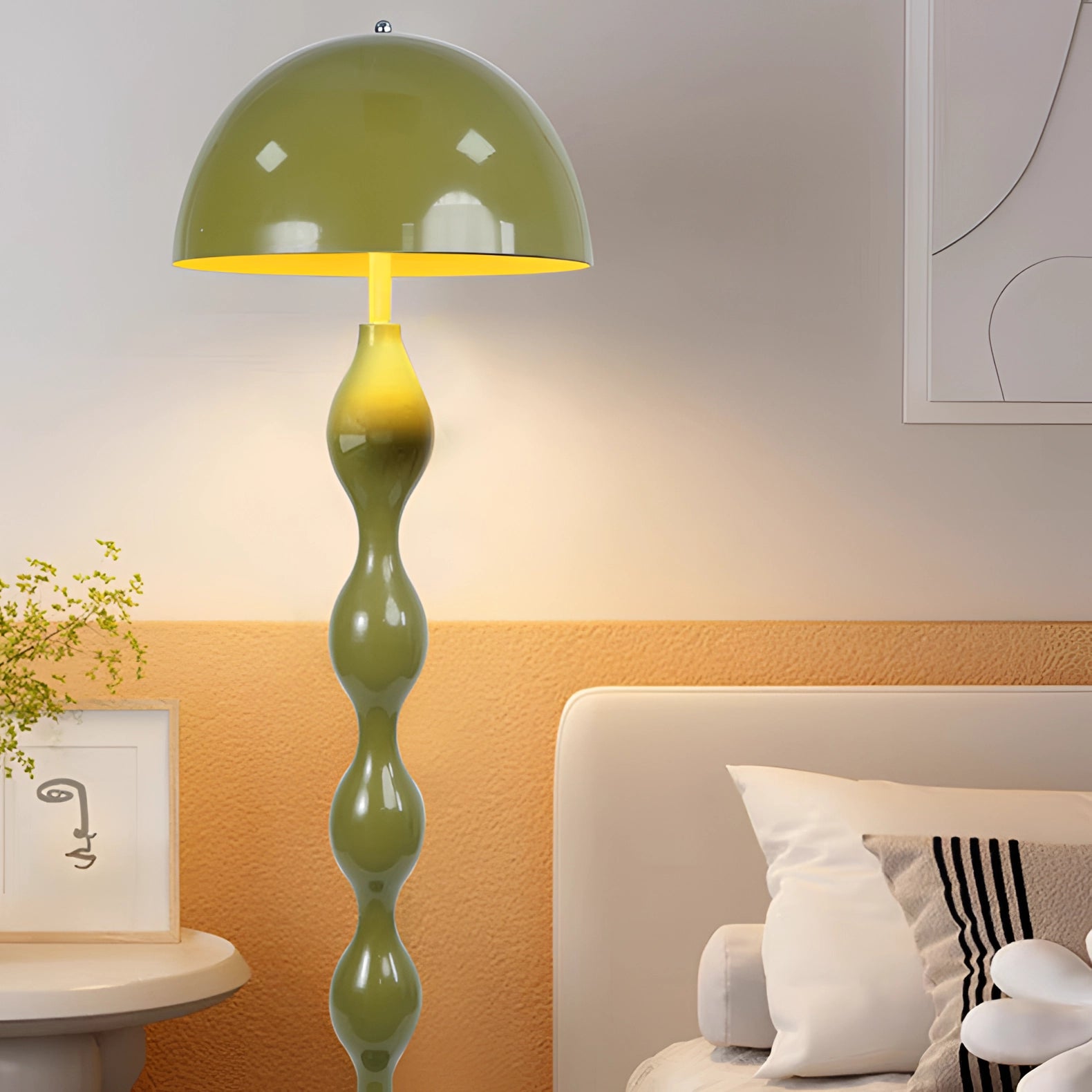 A green modern wavy floor lamp with a sculptural design, illuminating a contemporary interior setting.