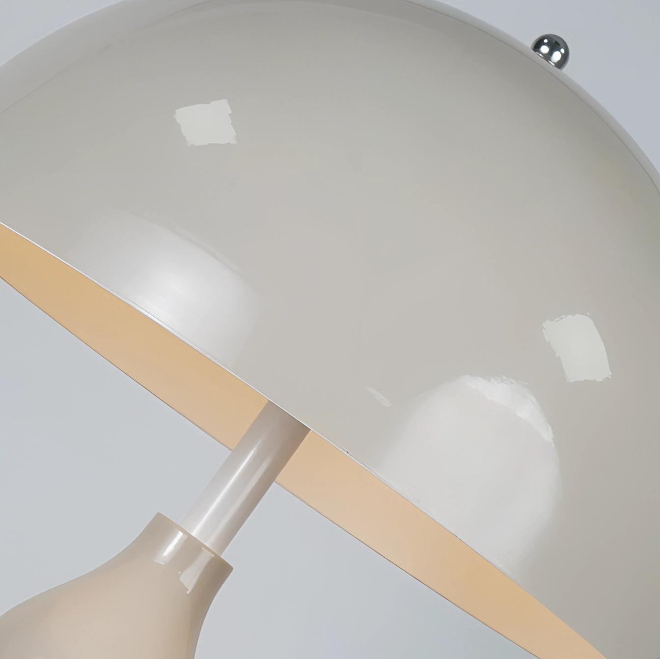 Modern red floor lamp with a wavy design, featuring a sculptural shape and contemporary style, made of plastic and metal with a circular base and a ceiling fixture.