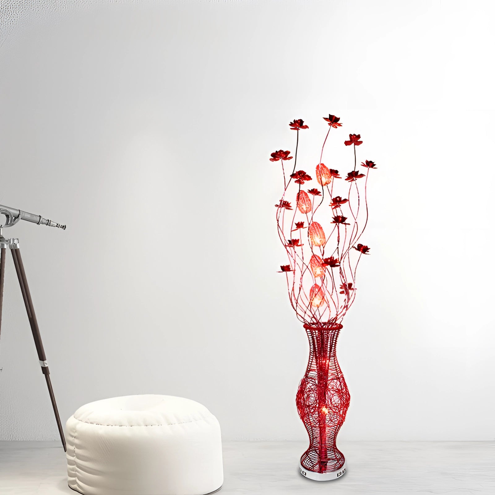Modern red wire vase sculpture for living room decor, featuring a creative artistic design in magenta, styled in a still life photography setup.