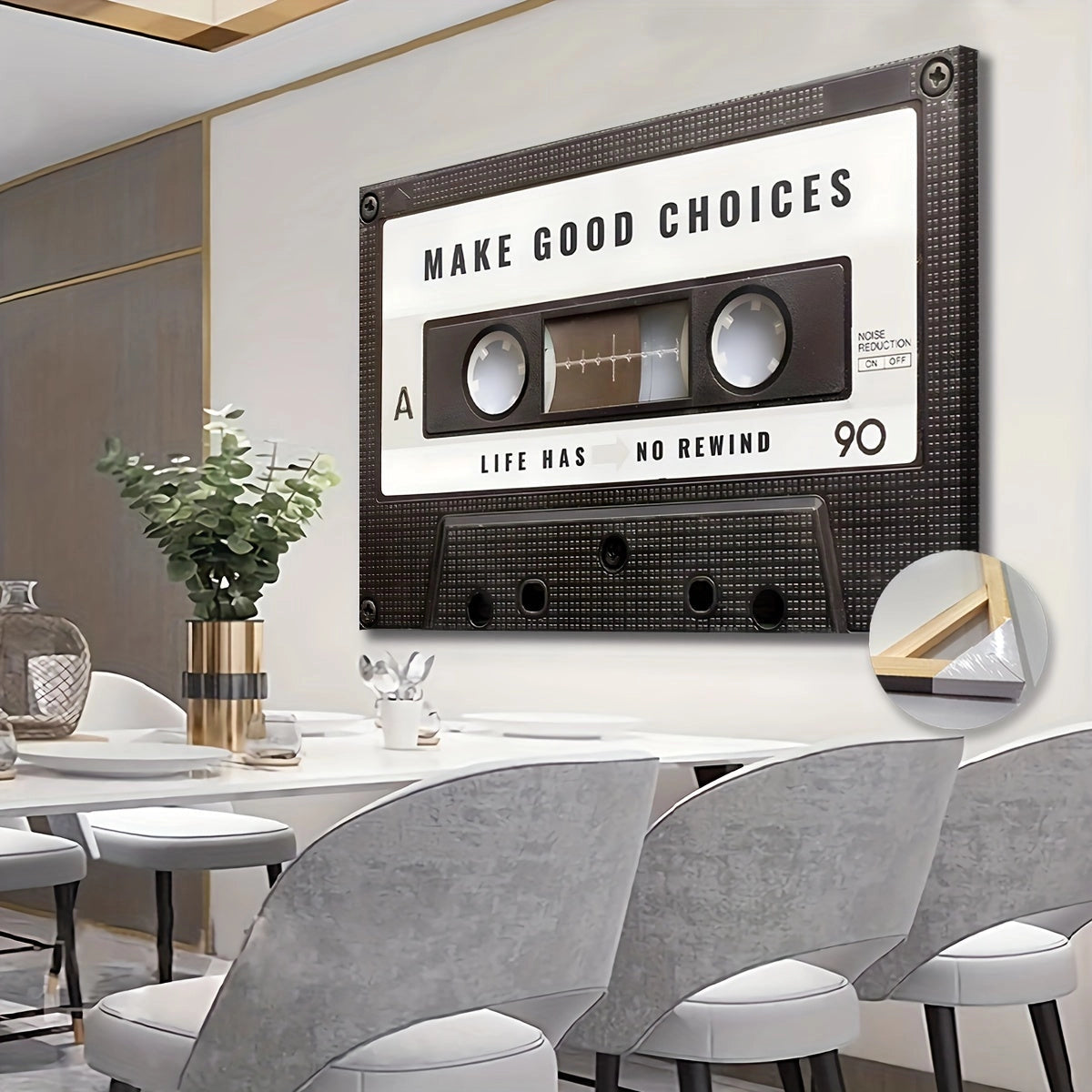 Retro cassette tape wall art with "Make Good Choices" motivational text, displayed in a stylish interior setting with a white table, chairs, a green plant, and tableware, enhancing the living room decor.
