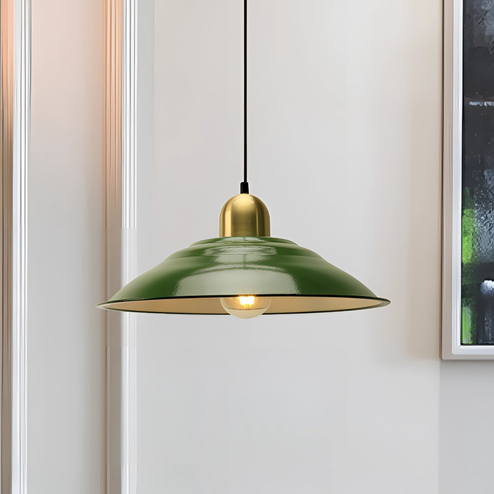 Retro green enamel pendant light with gold trim, featuring a vintage design. The light fixture is composed of a mix of materials, including metal and glass, with a circular shade that adds a classic touch to any ceiling.