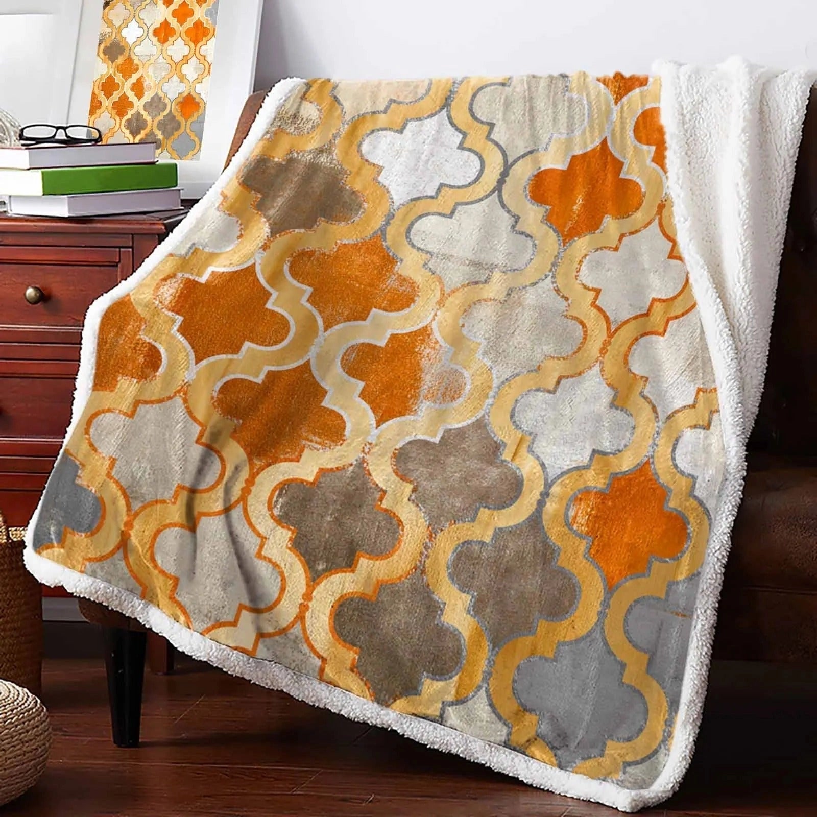 Retro Moroccan Orange Cashmere Blanket with a warm brown and orange pattern, ideal for cozy winter decor, displayed on a wooden surface.