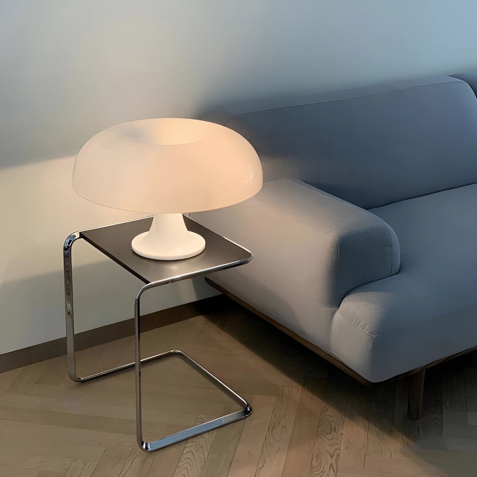 Retro orange mushroom lamp with a mid-century modern design, featuring a sleek wooden base and a vibrant orange shade, elegantly illuminating a cozy interior setting.