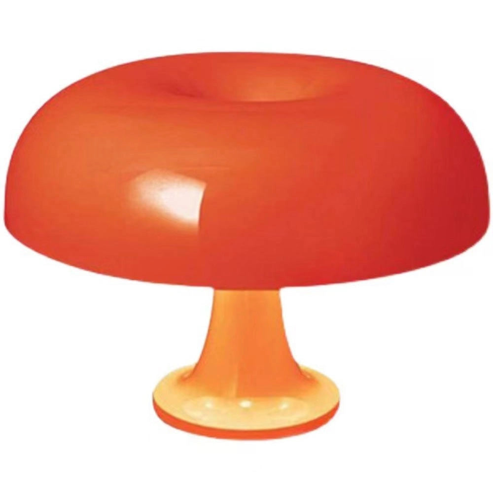 Retro orange mushroom lamp with a mid-century modern design, featuring a smooth plastic exterior in a peach tint, sitting on a table.