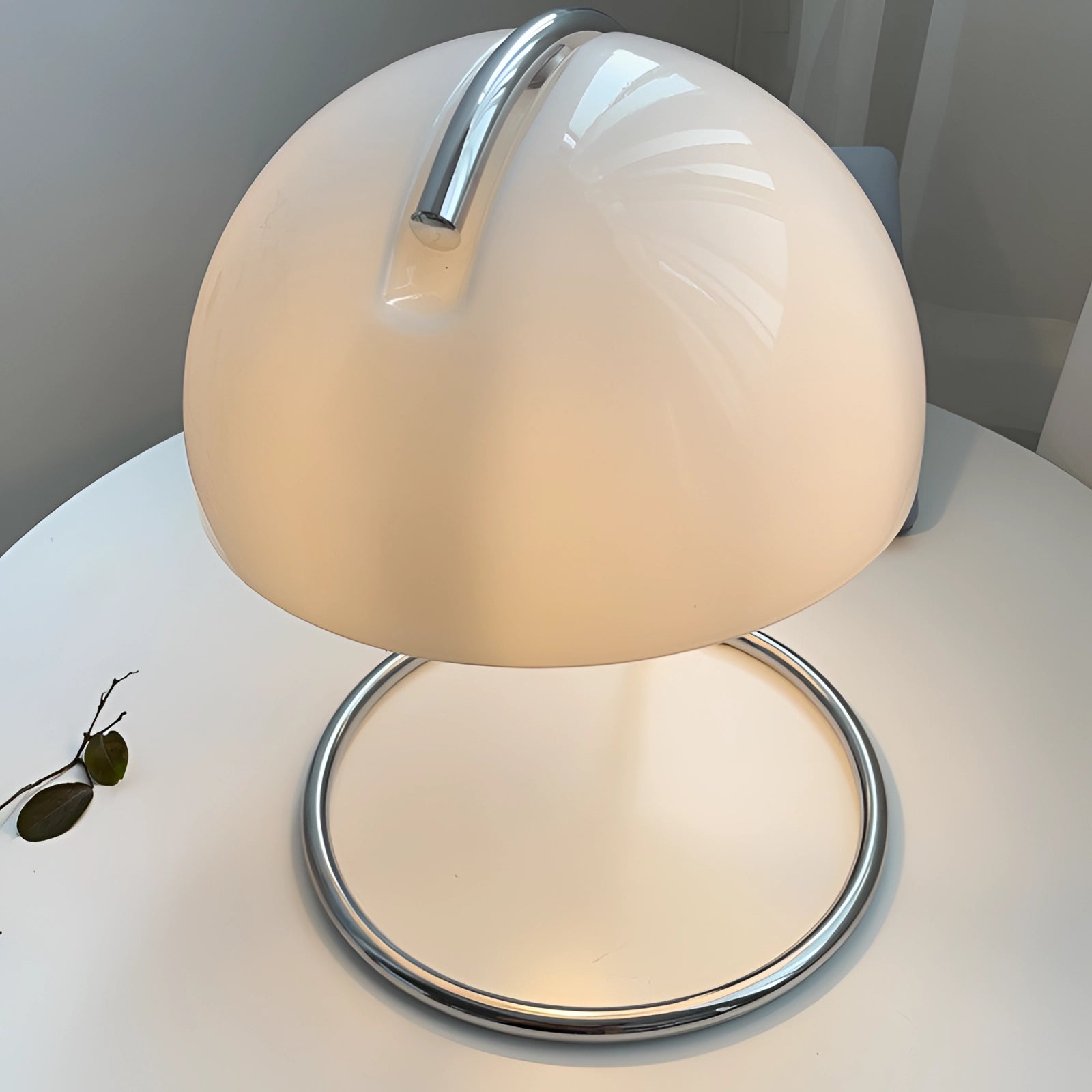 Retro yellow chrome mid-century desk lamp with an elegant design, featuring a sleek circular base and a rounded chrome shade, perfect for stylish table lighting.