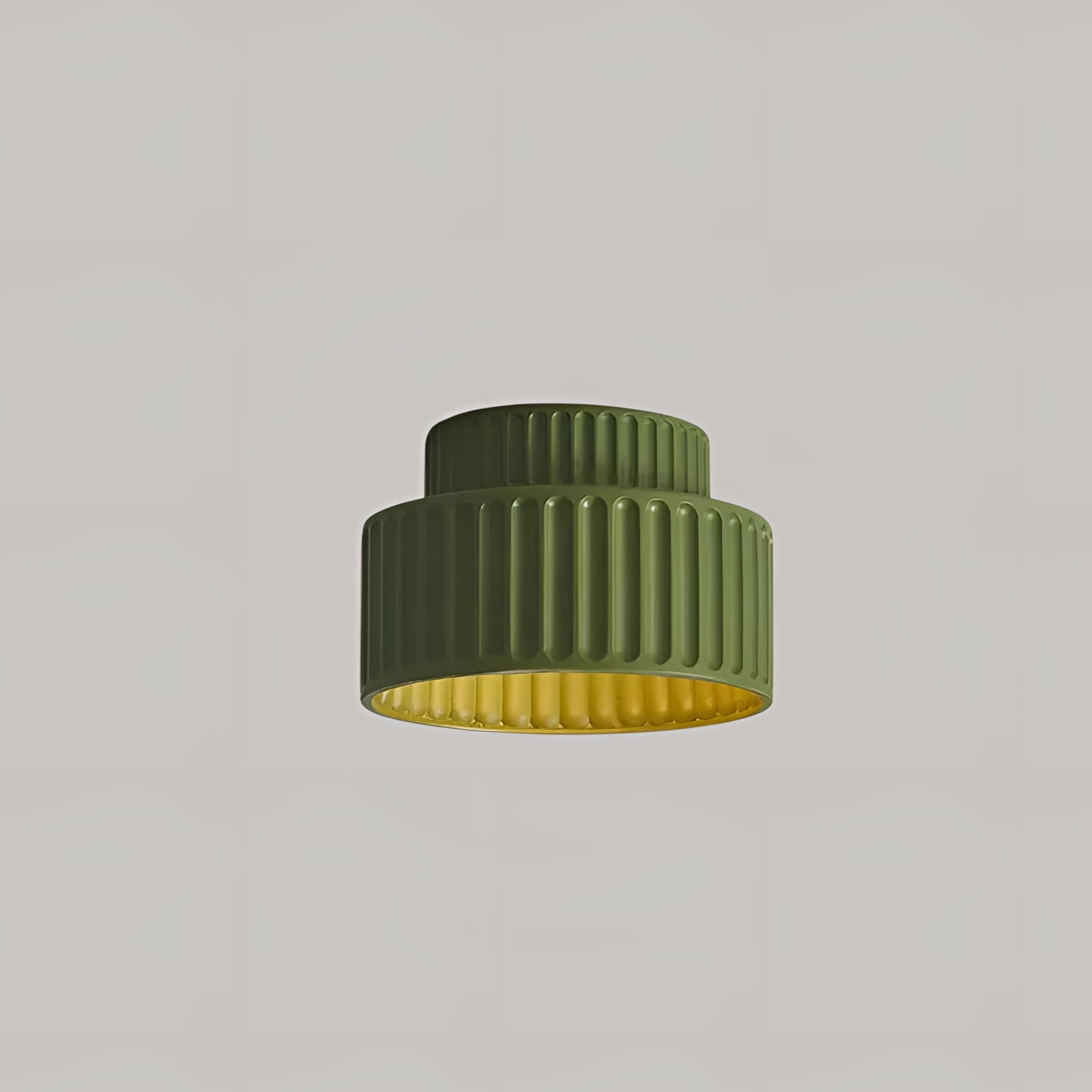 Modern energy-efficient ribbed LED pendant lamp in a green color with warm white light, featuring a cylindrical shape, suitable as a ceiling fixture.