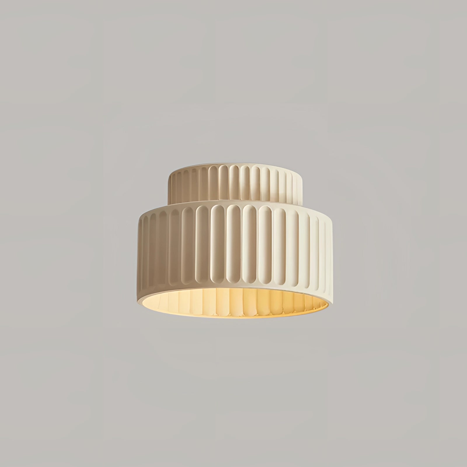 Modern ribbed LED pendant lamp with a beige lampshade emitting warm white light, featuring a sleek cylindrical design and hanging as a ceiling fixture, offering an energy-efficient lighting solution.