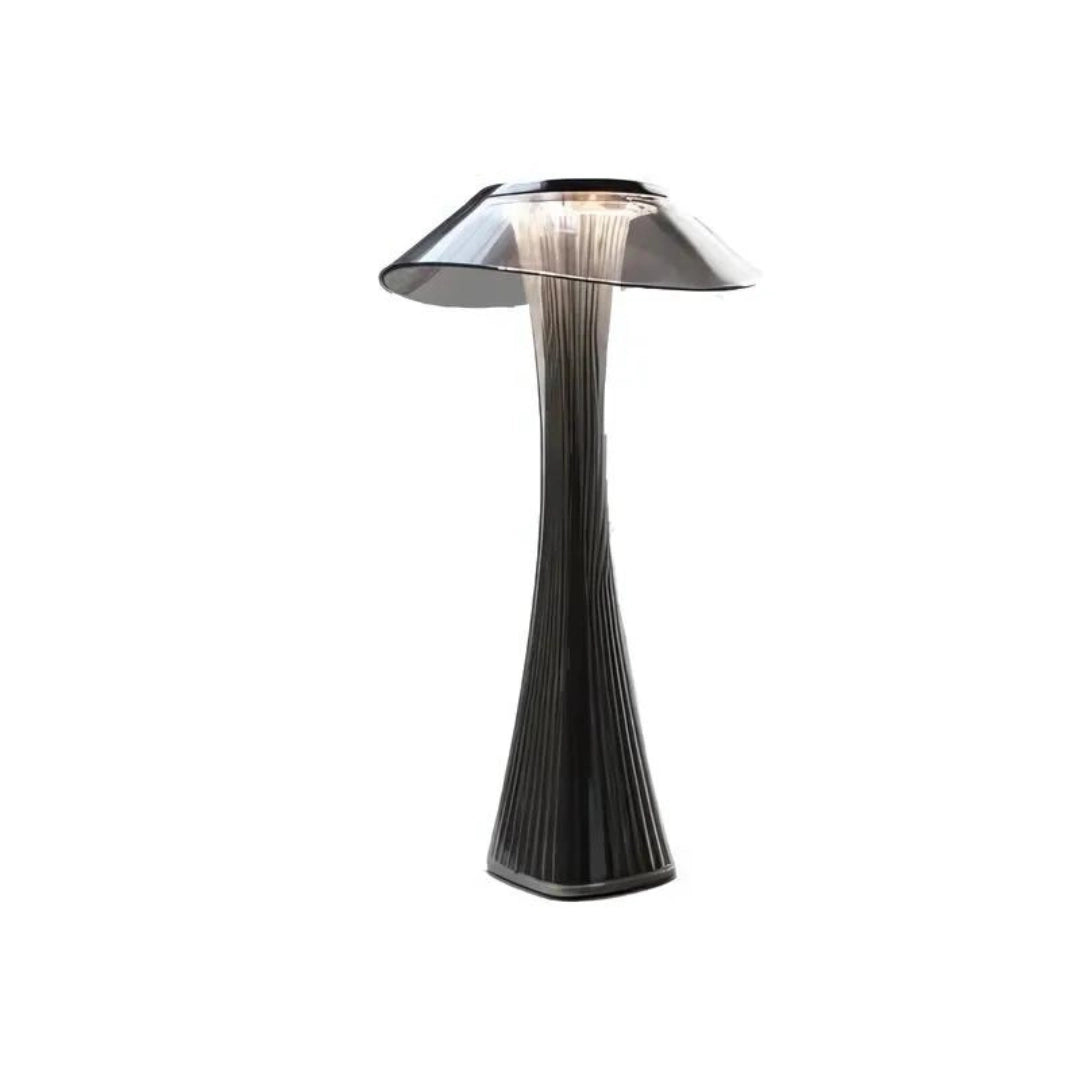 Rose Gold Pleated Table Lamp with a black base, showcasing an elegant modern design featuring luxurious pleated metal detailing, placed on a wooden table.