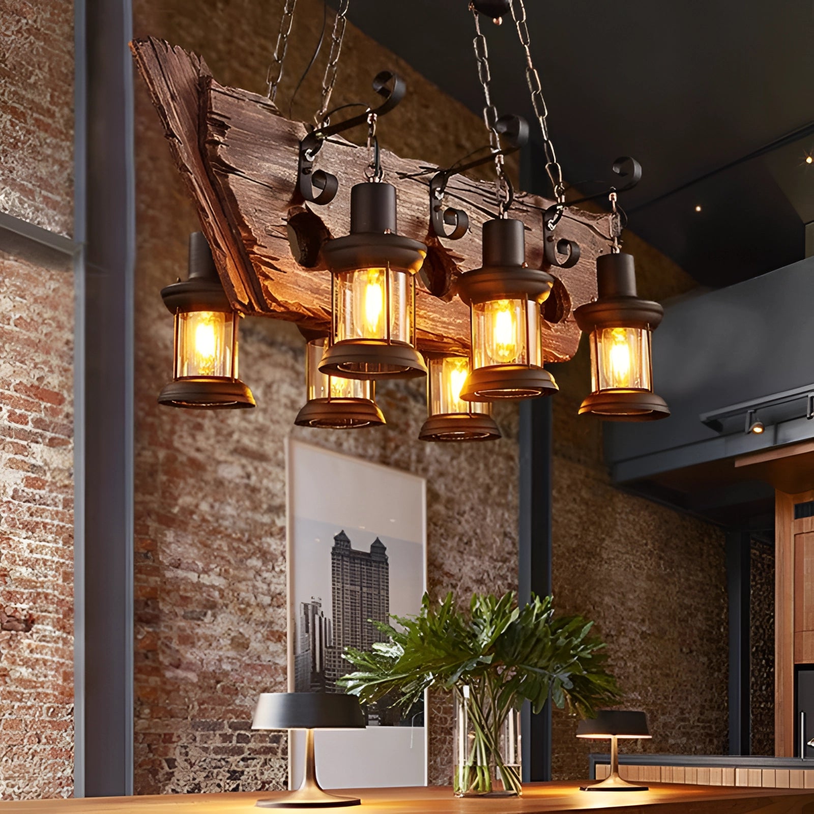 Rustic farmhouse chandelier featuring a wood beam and industrial pendant lights hanging above a table with houseplants and flowerpots, highlighting a cozy interior design.