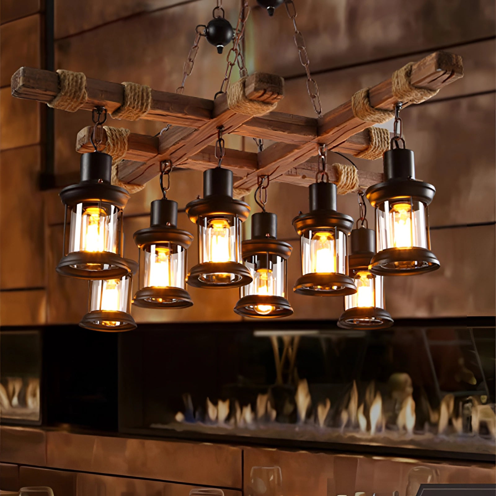 Rustic farmhouse pendant light with a vintage lantern design featuring Edison bulbs, hanging in an interior setting with wooden accents and a glass window in the background.
