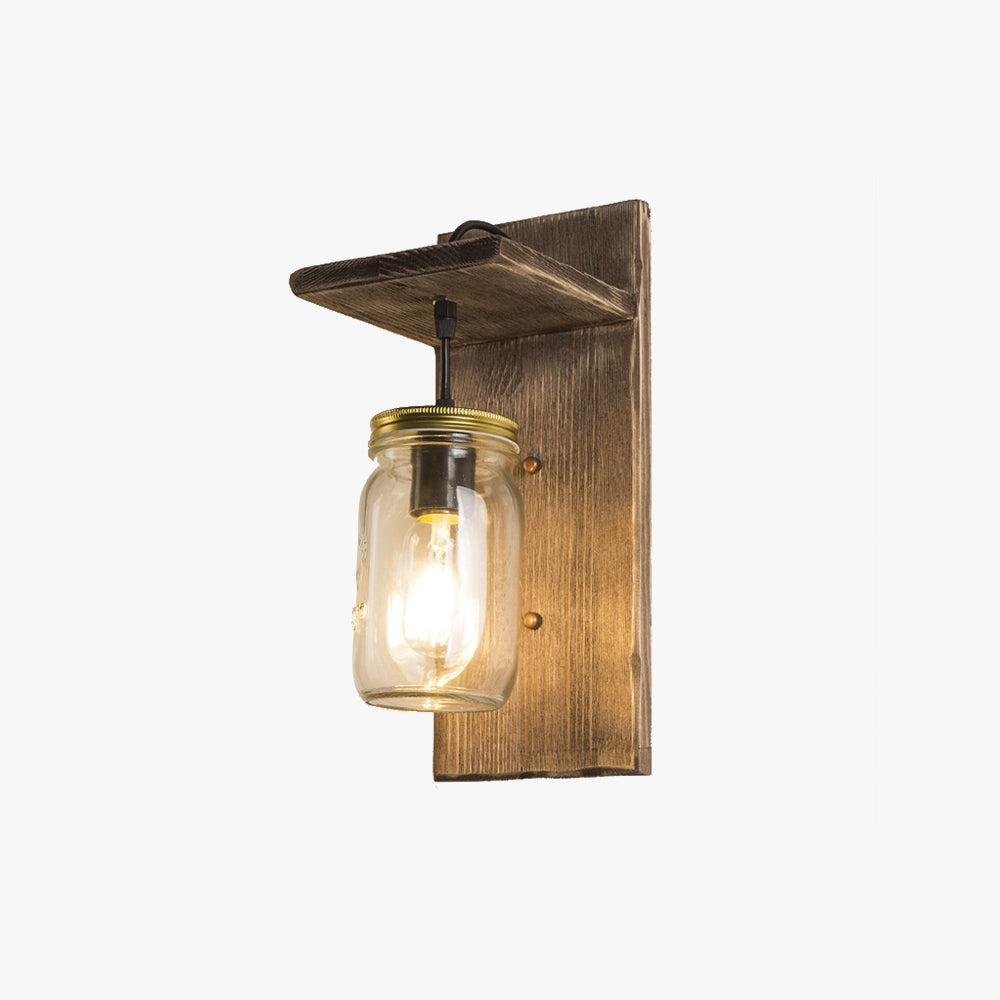 Rustic mason jar wood wall sconce featuring a vintage farmhouse design with a wooden backboard, stained finish, and metal light fixture.