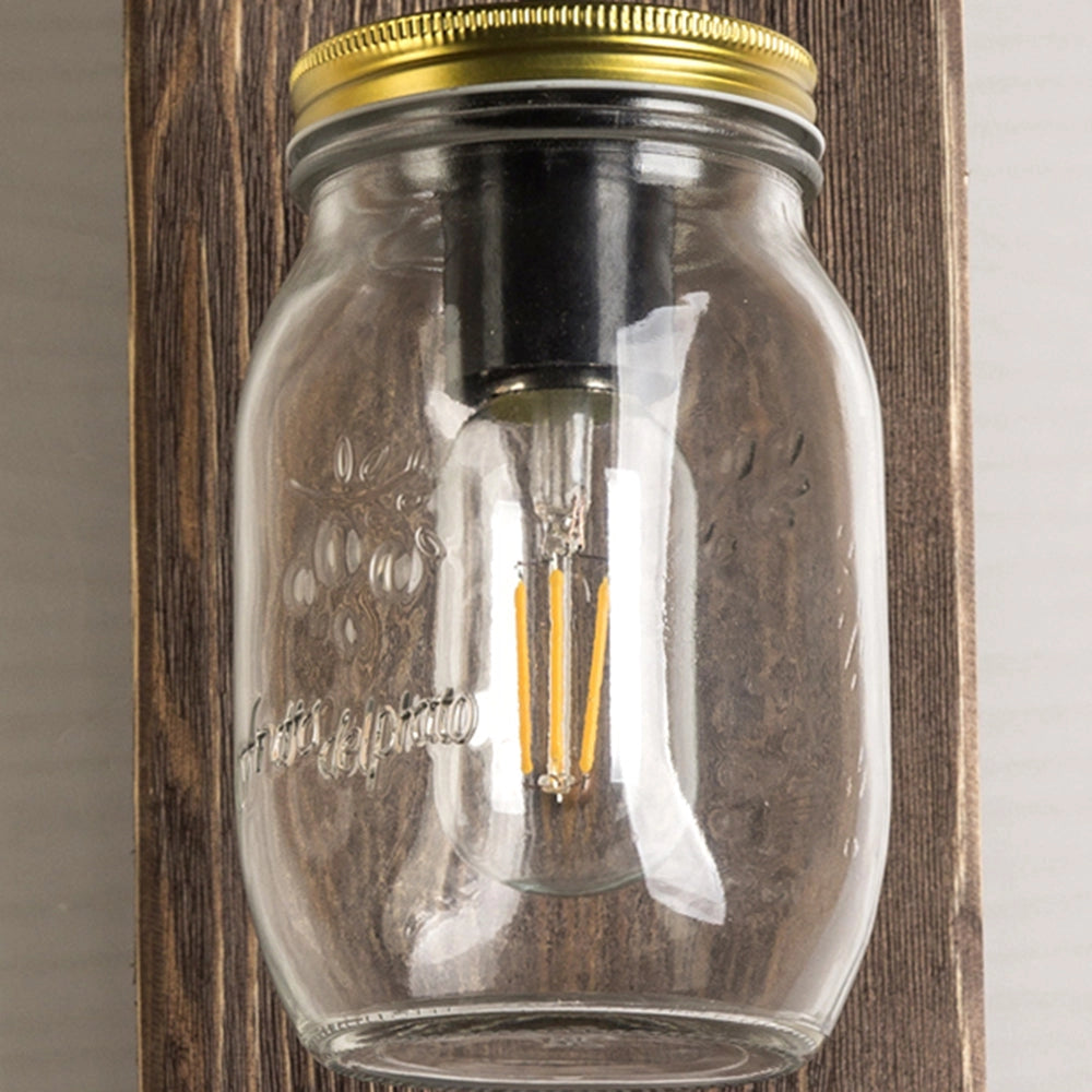 Rustic Mason Jar Wood Wall Sconce featuring a vintage farmhouse design with a glass mason jar mounted on a wooden rectangular base, perfect for adding a cozy, rustic charm to any room.