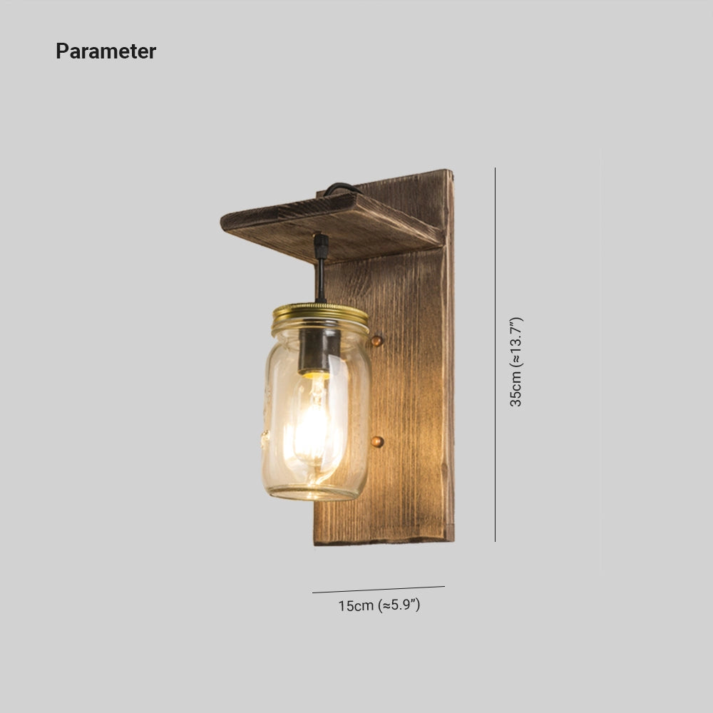 Rustic Mason Jar Wood Wall Sconce featuring a vintage farmhouse design with a clear mason jar as the light fixture, set against a rectangular stained wood backplate, highlighting metal accents and exposed light bulb.