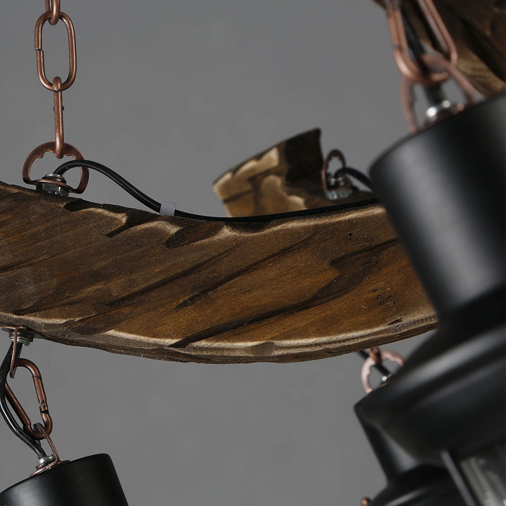 Rustic metal and wood chandelier with a cabin decor style, featuring a combination of metal and wooden elements to create a warm and inviting lighting fixture.