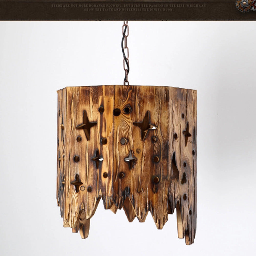Rustic star cut-out wooden pendant light with farmhouse design, featuring a rectangular shape and natural wood texture, suspended from a ceiling.