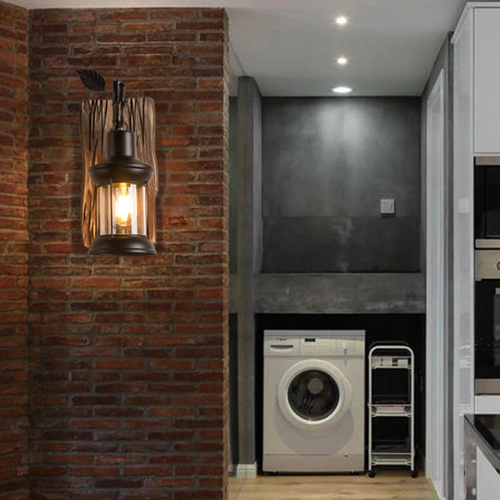 Rustic vintage lantern sconce with a wooden mount installed on a wall in a cozy laundry room setting.