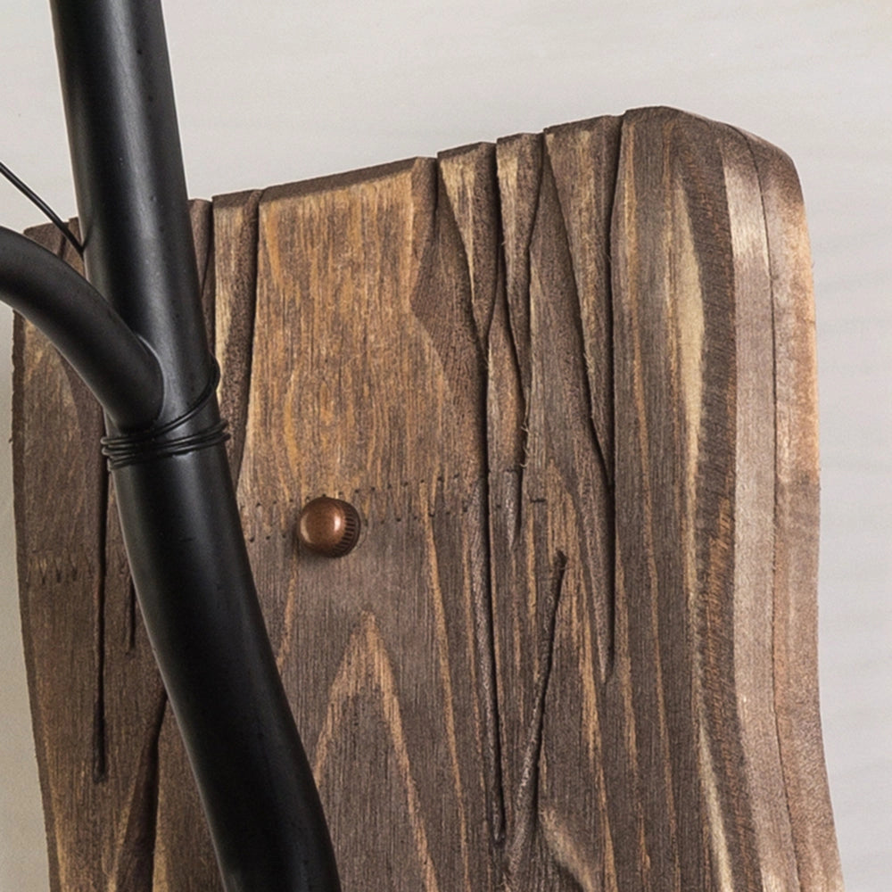 Rustic vintage lantern sconce mounted on a wooden base, featuring a metal frame with intricate patterns, suitable for cabin lighting. The beige and wood tones complement the rustic aesthetic, highlighting the natural wood grain and wood stain finish.