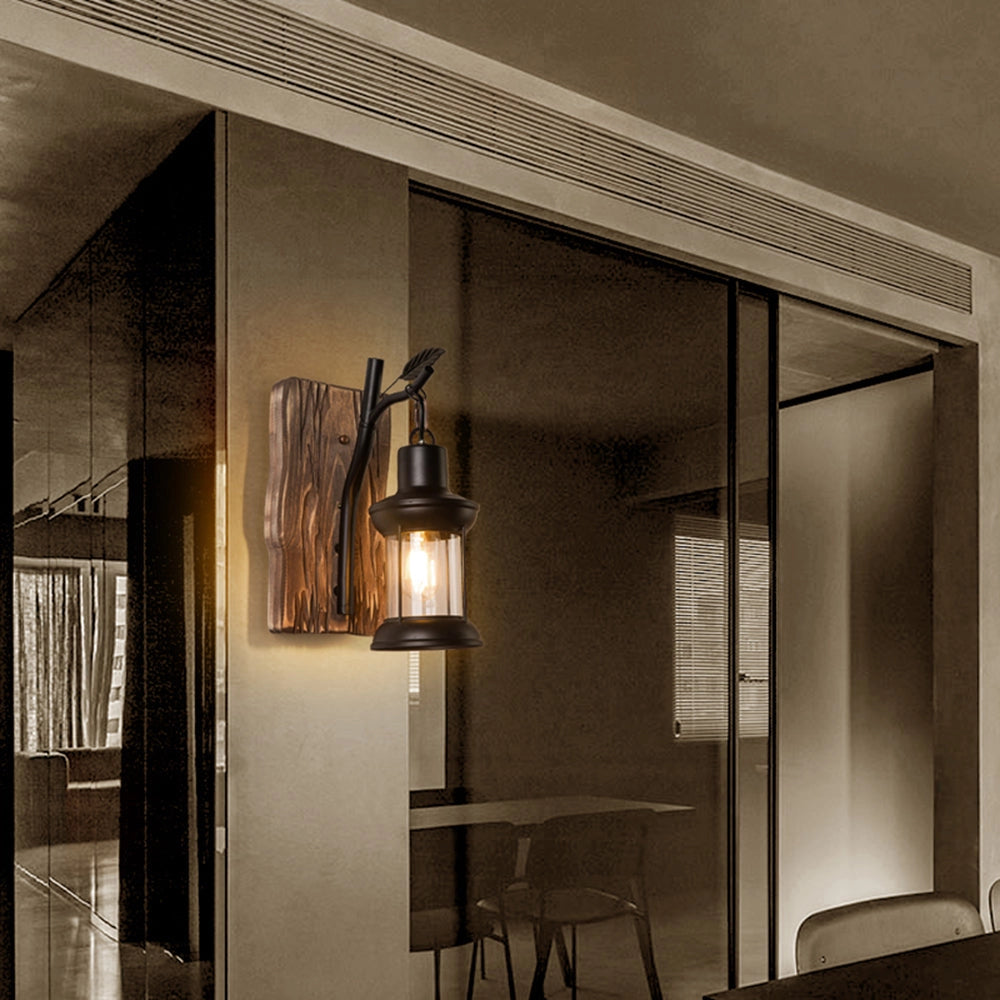 Rustic vintage lantern sconce mounted on a wooden base, designed for cabin lighting, featuring a classic lamp shade that complements the architectural wooden elements of interior design.