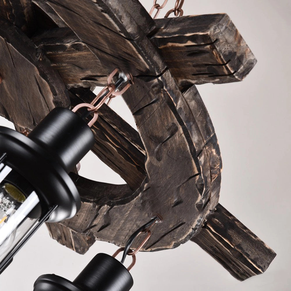 Rustic wagon wheel farmhouse chandelier featuring vintage lantern lights, designed to resemble a decorative wheel with multiple hanging lanterns for a farmhouse or rustic decor ambiance.
