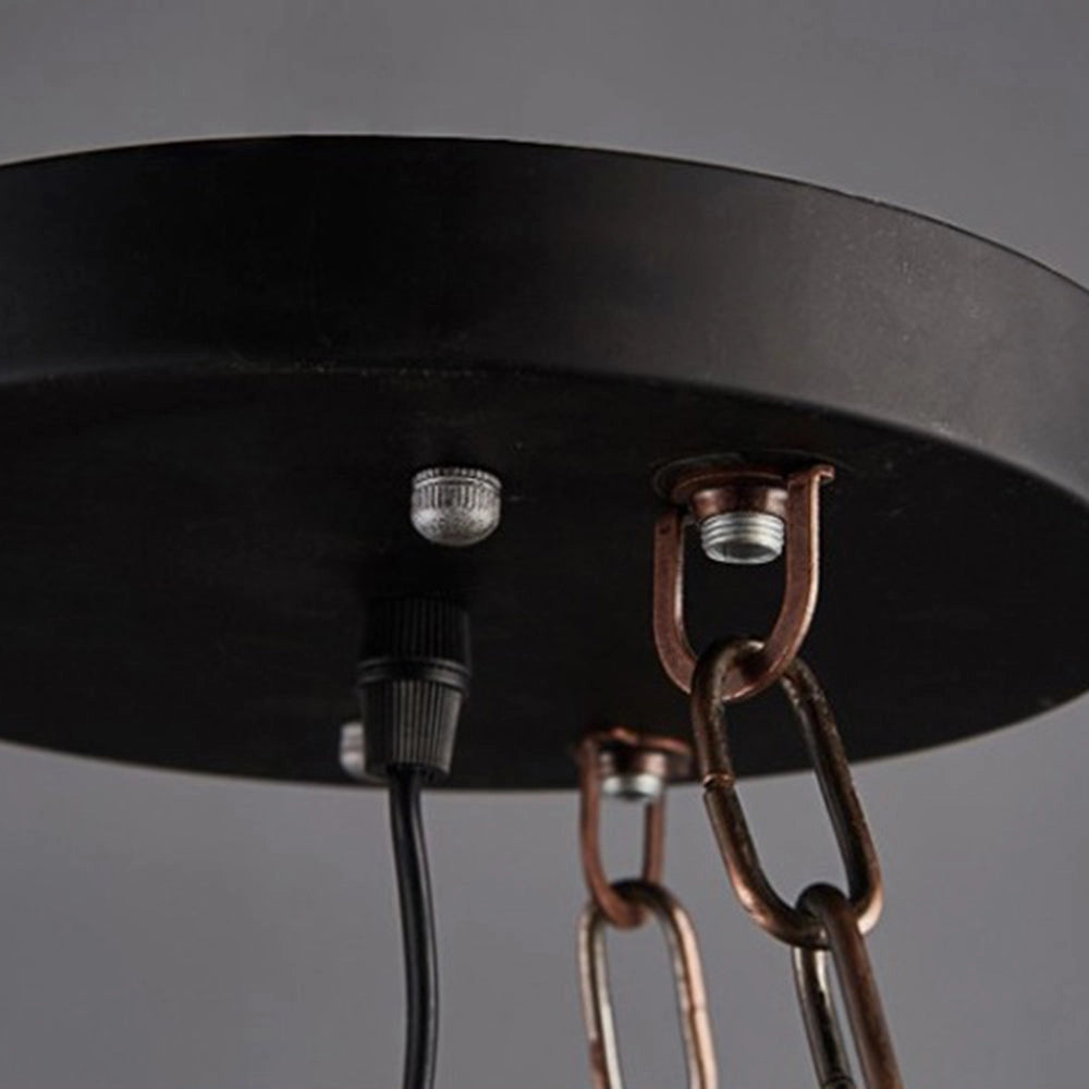Rustic wagon wheel farmhouse chandelier featuring vintage lantern lights, constructed with metal and wood elements, showcasing a circular design with intricate cable wiring.