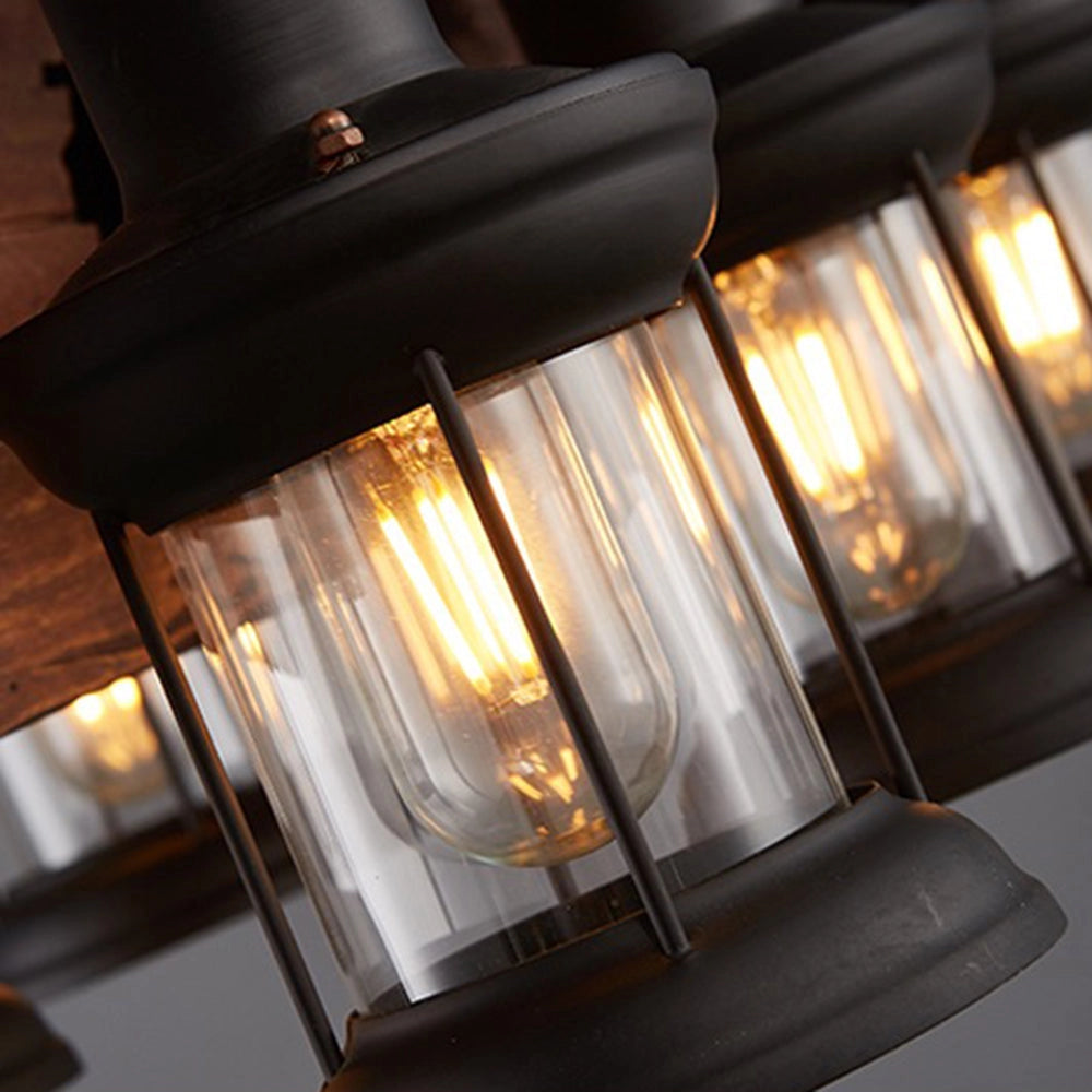 Rustic wagon wheel farmhouse chandelier with vintage lantern light design, featuring wooden accents and multiple lantern-style lamps arranged around a circular frame, evoking a classic and cozy ambiance.
