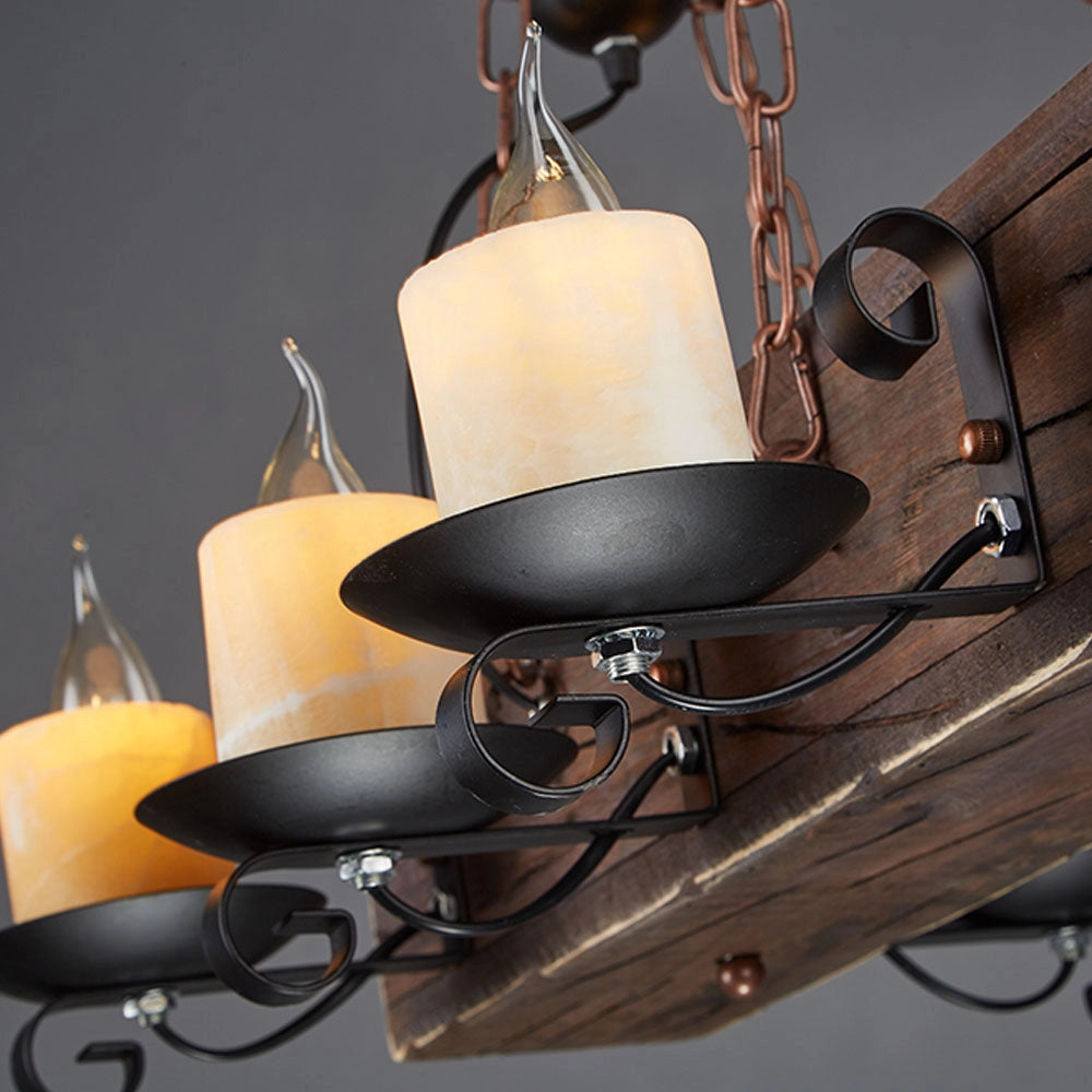 Rustic wooden beam chandelier with antique bronze finish, featuring a wooden beam design combined with metal elements, suspended as a ceiling fixture, emitting warm lighting and accentuated by lampshades.