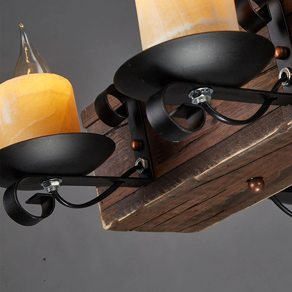Rustic wooden beam chandelier with an antique bronze finish featuring a metal sconce and light fixture, designed to add a vintage and elegant touch to any room.