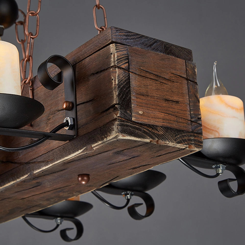 Rustic wooden beam chandelier with antique bronze finish featuring multiple light bulbs, suspended from the ceiling with metal chains.