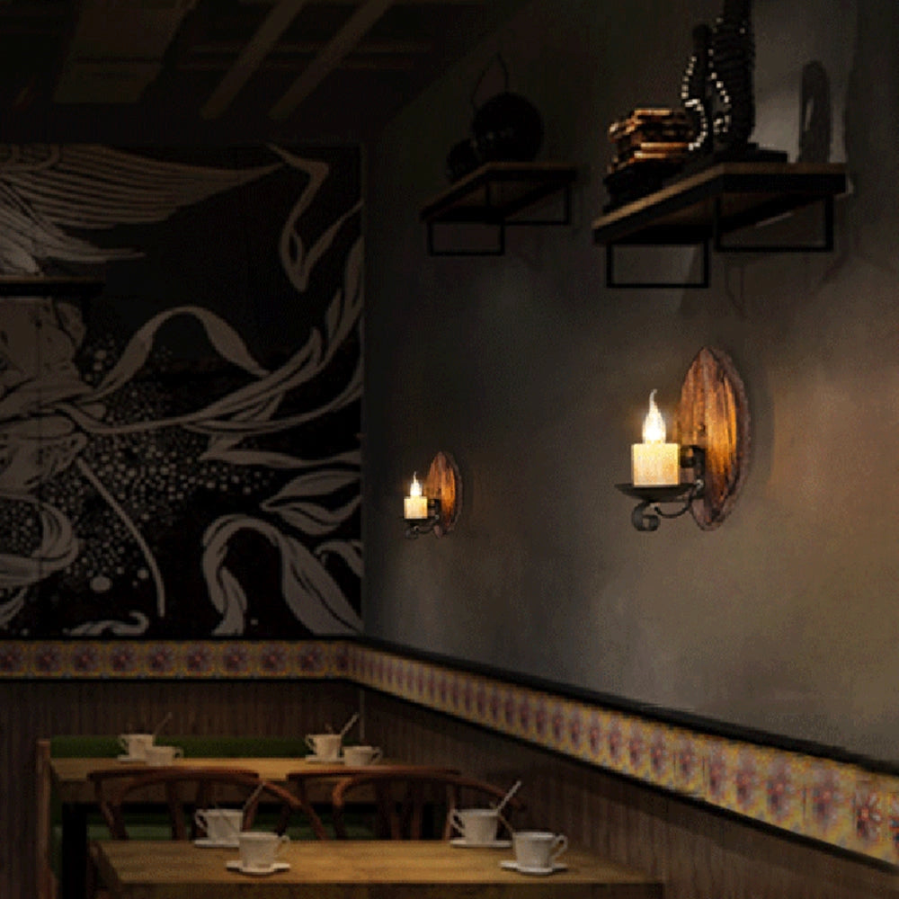 Rustic wooden wall sconce featuring a battery-operated flameless candle light, mounted on a wooden wall with a cozy interior design.