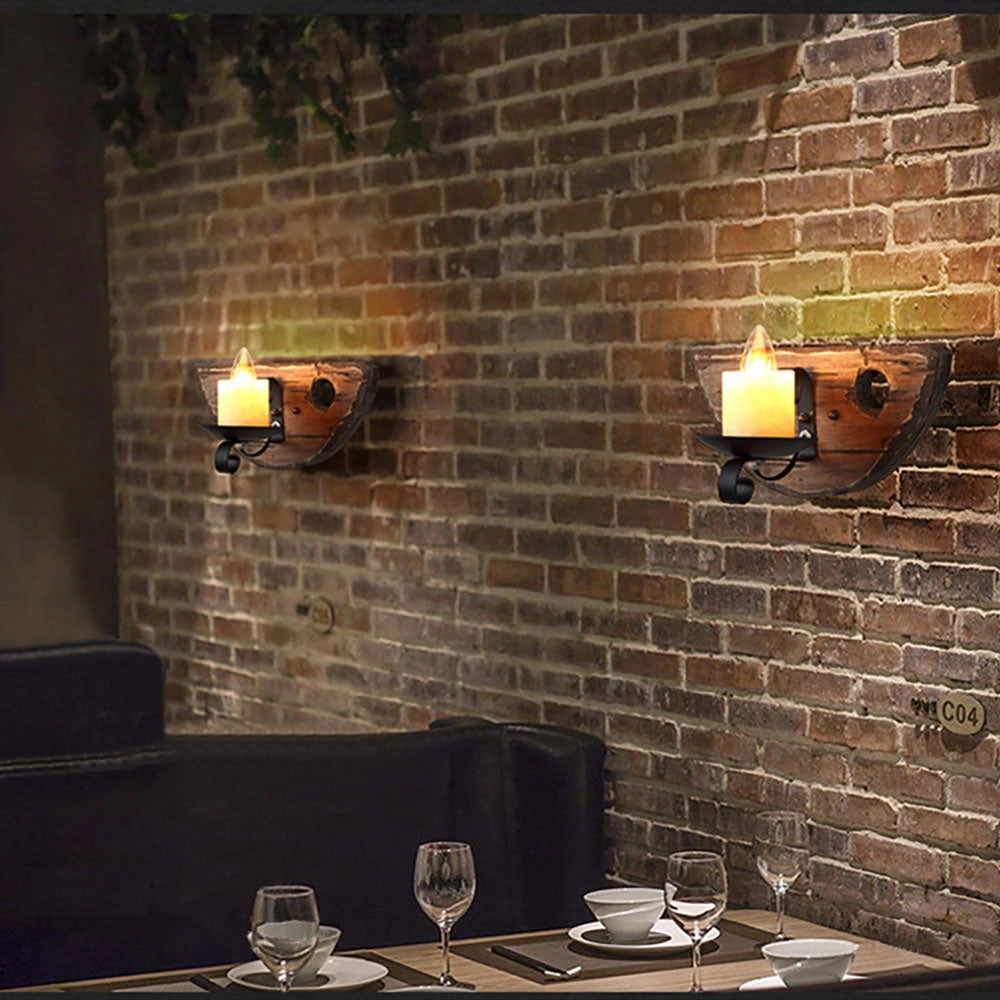 Rustic wooden wall sconce featuring a vintage candle holder design, suitable for farmhouse decor, displayed against a brick wall.