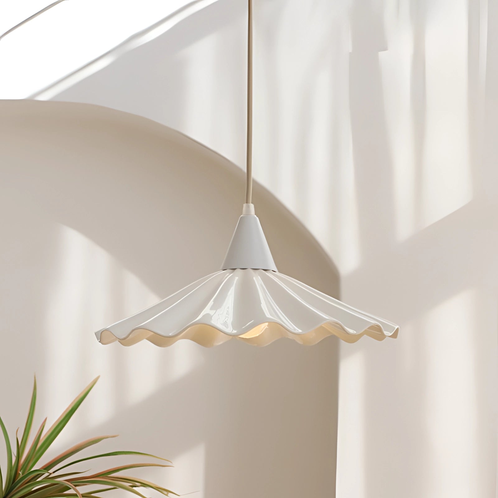 Scallop-edged LED pendant light with a modern decorative design, featuring a wood-textured shade and artistic elements, hanging from the ceiling.
