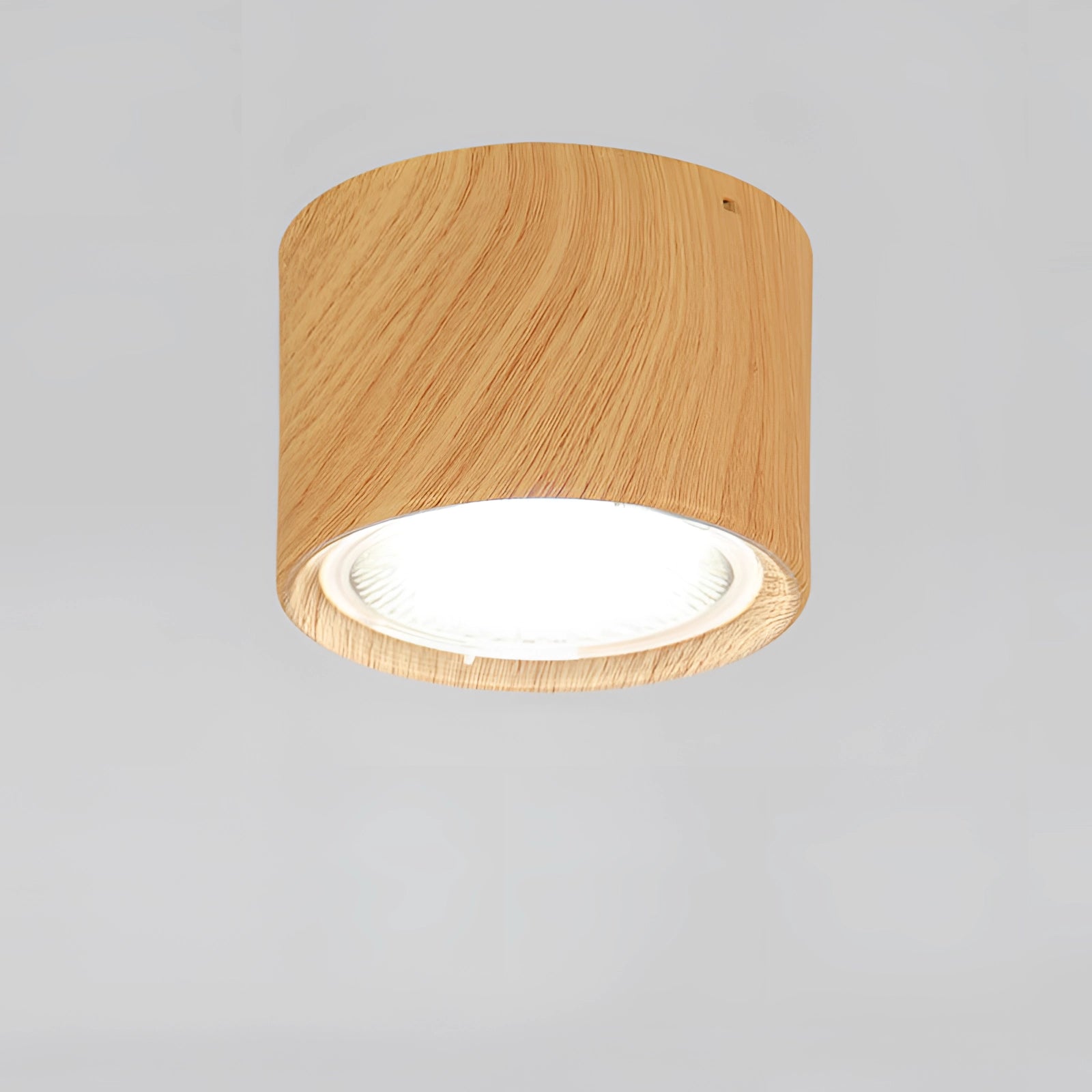 
A Scandinavian LED spotlight in a modern kitchen setting with a light wood finish, mounted on a beige ceiling.