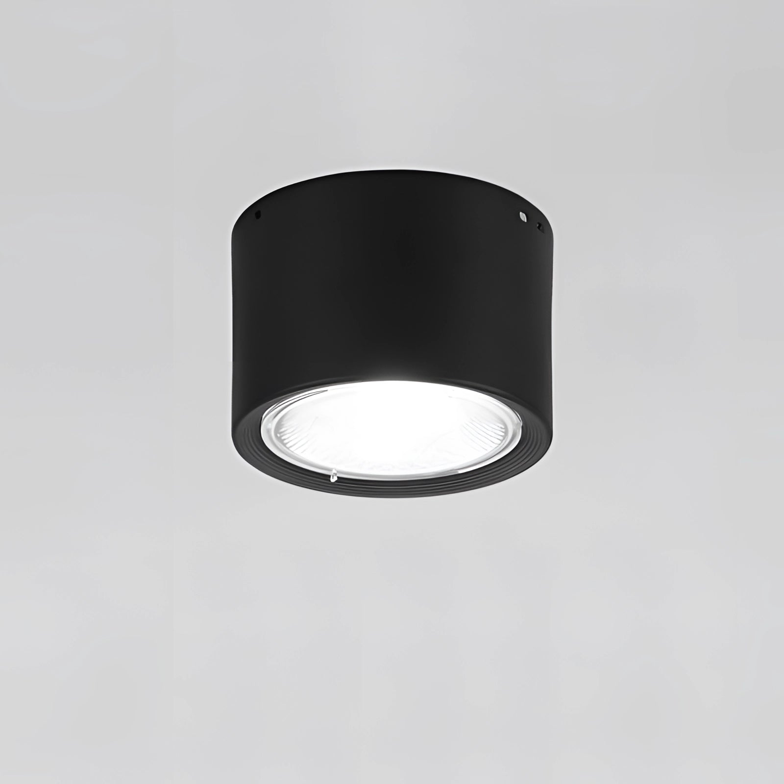 Scandinavian LED spotlight with a small black cylindrical design, warm 3000K light, and light wood finish, suitable for modern kitchen ceiling lighting.