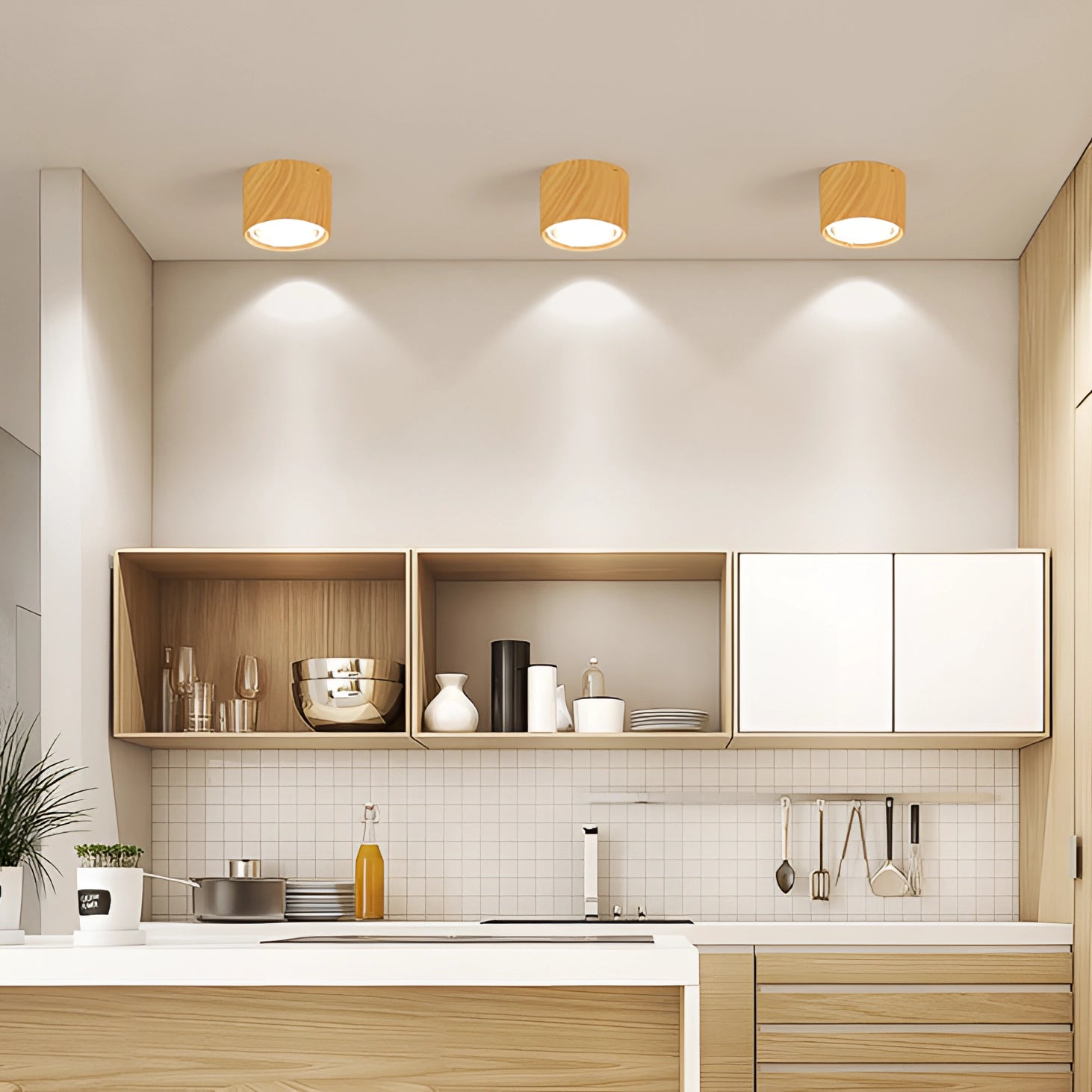 Scandinavian LED spotlight illuminating a modern kitchen with light wood finish, featuring sleek cabinetry, a countertop, and shelving adorned with houseplants.