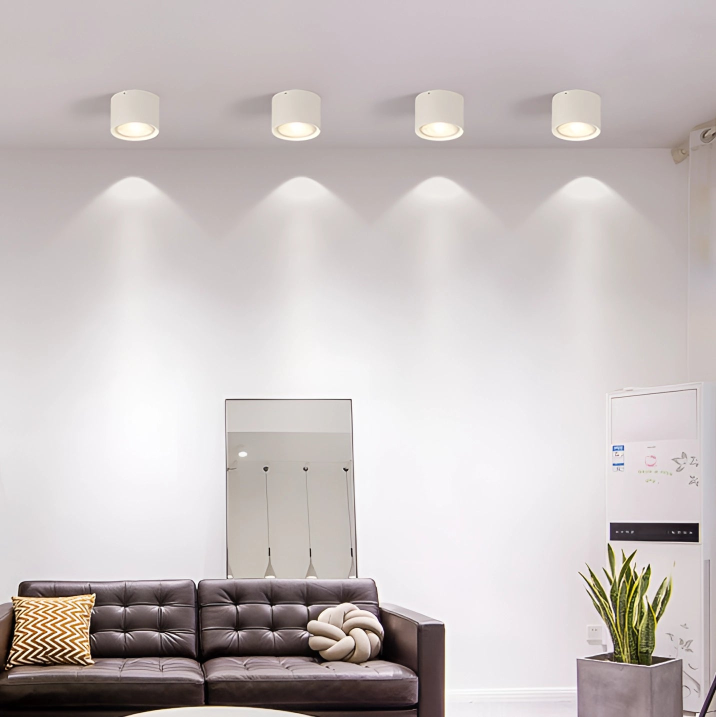 Scandinavian LED spotlight with a light wood finish, mounted in a modern kitchen setting, illuminating a stylish interior with furniture and decorative plants.