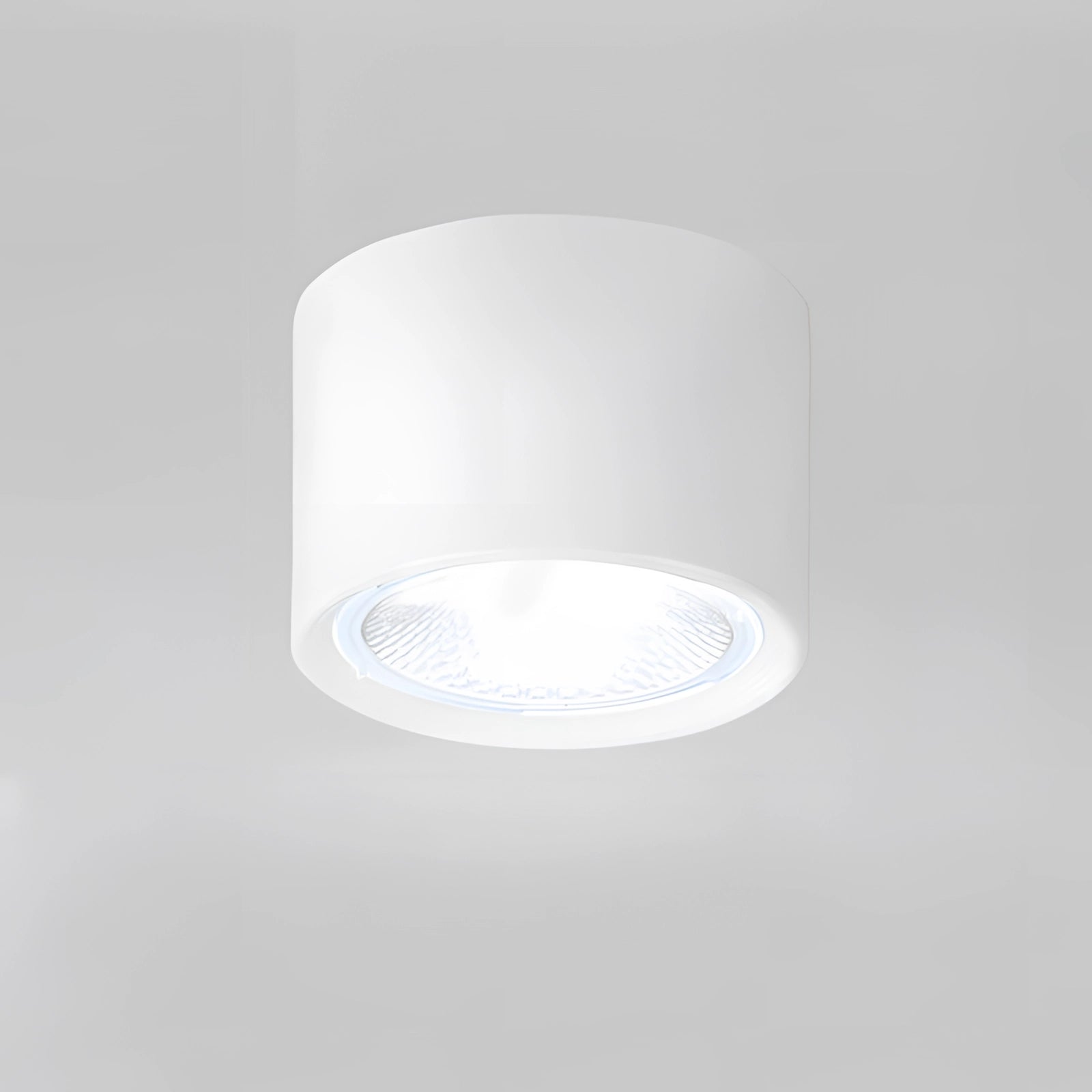 Large white Scandinavian LED spotlight with a modern design, featuring a light wood finish and warm light (3000K), mounted as a ceiling fixture. The spotlight has a cylindrical shape with a glass element, offering a sleek and contemporary look ideal for kitchen lighting.