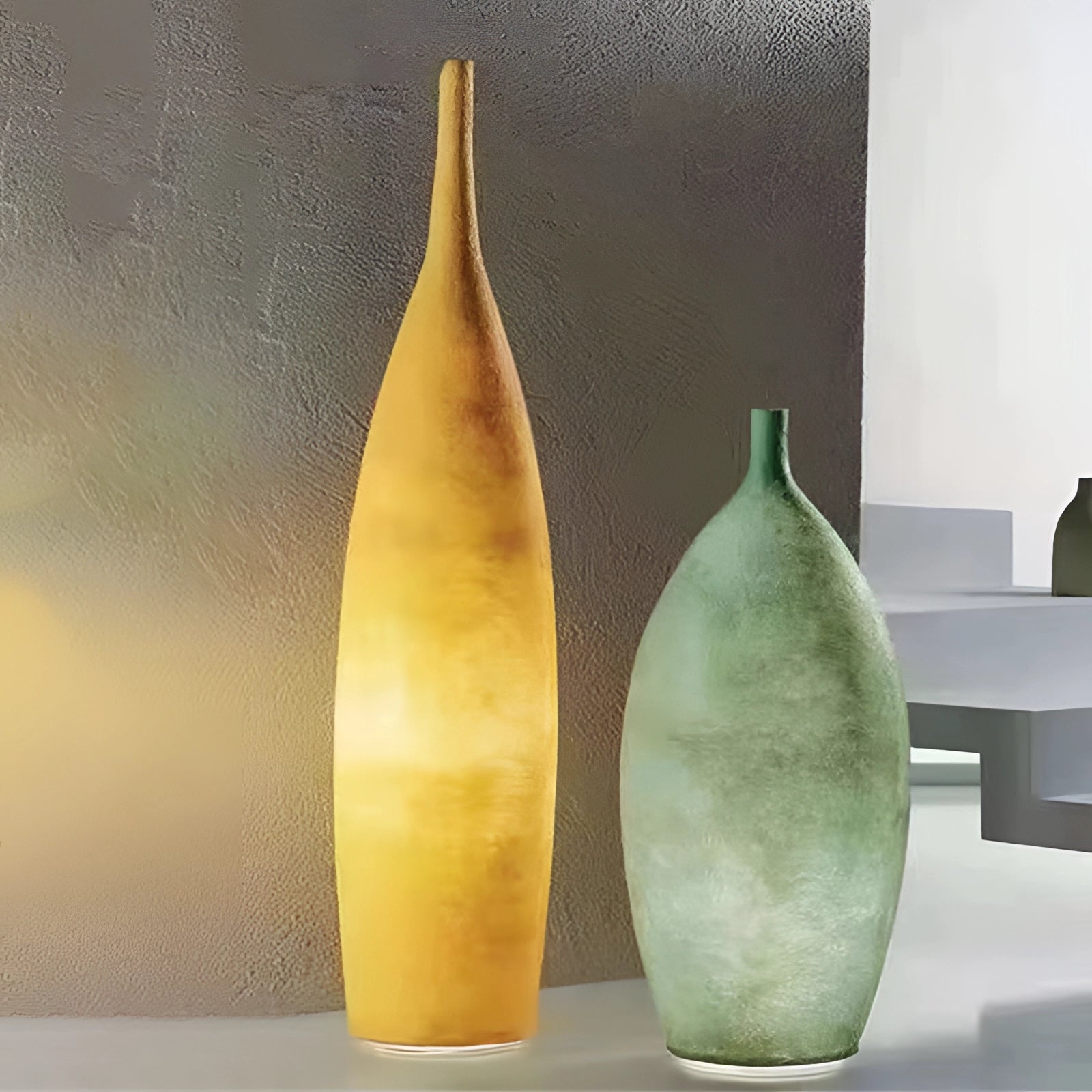 Tall narrow ceramic vase with a Scandinavian minimalist design, featuring a distressed finish.